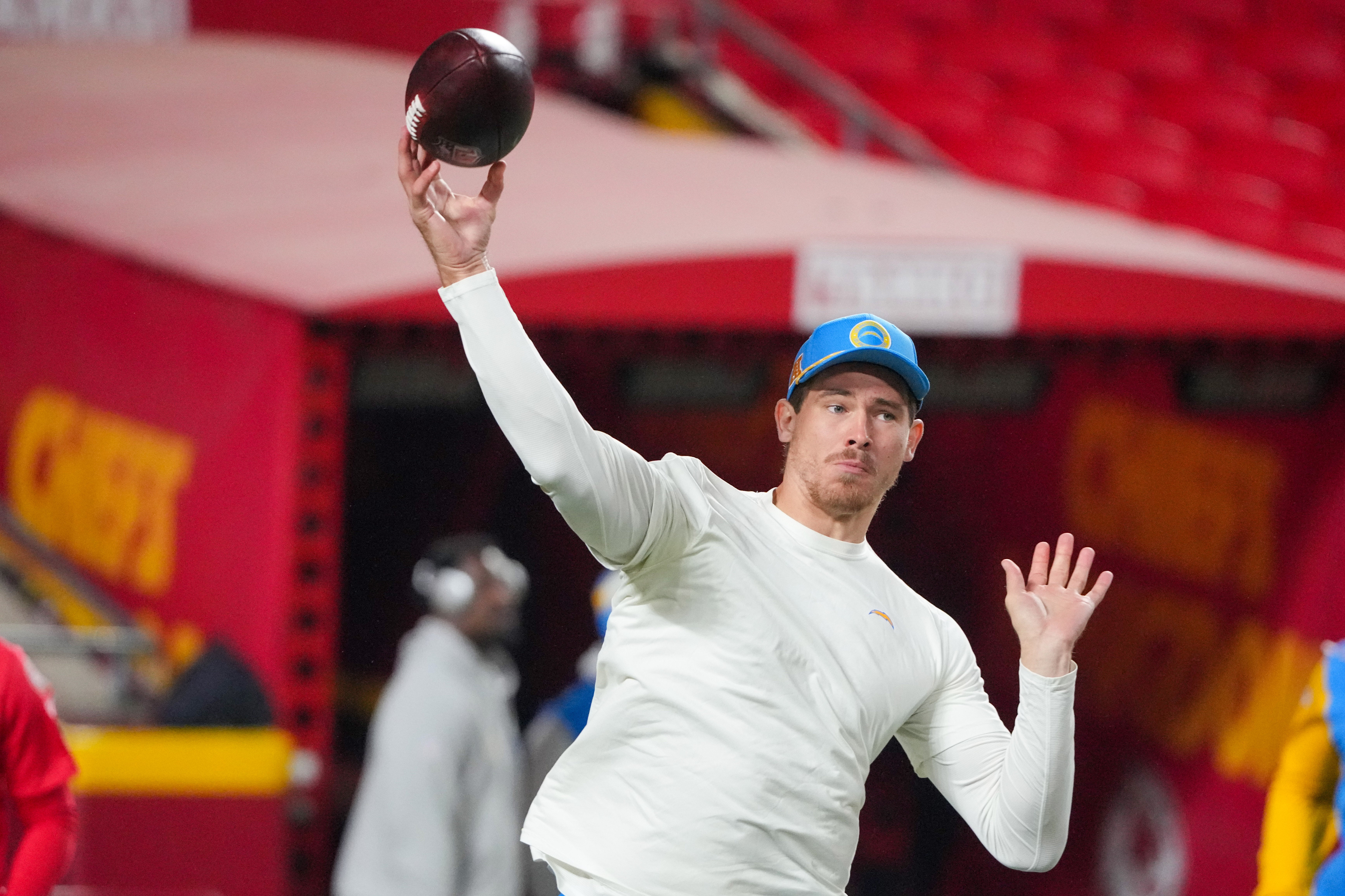 Los Angeles Chargers quarterback Justin Herbert (10) warms up against the Kansas City Chiefs prior to a game at GEHA Field at Arrowhead Stadium.