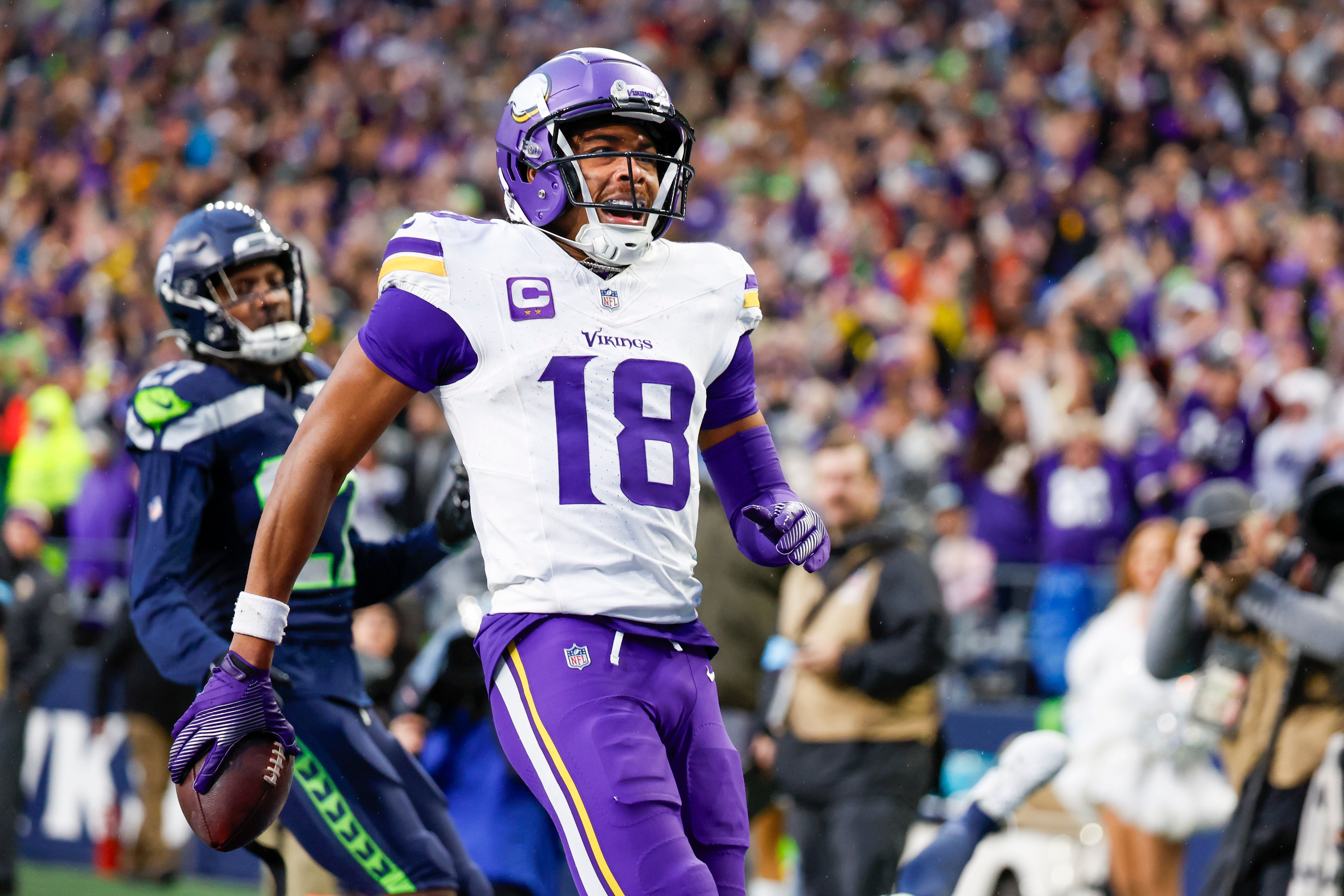 Dec 22, 2024; Seattle, Washington, USA; Minnesota Vikings wide receiver Justin Jefferson (18) celebrates after catching a touchdown pass against the Seattle Seahawks during the fourth quarter at Lumen Field.
