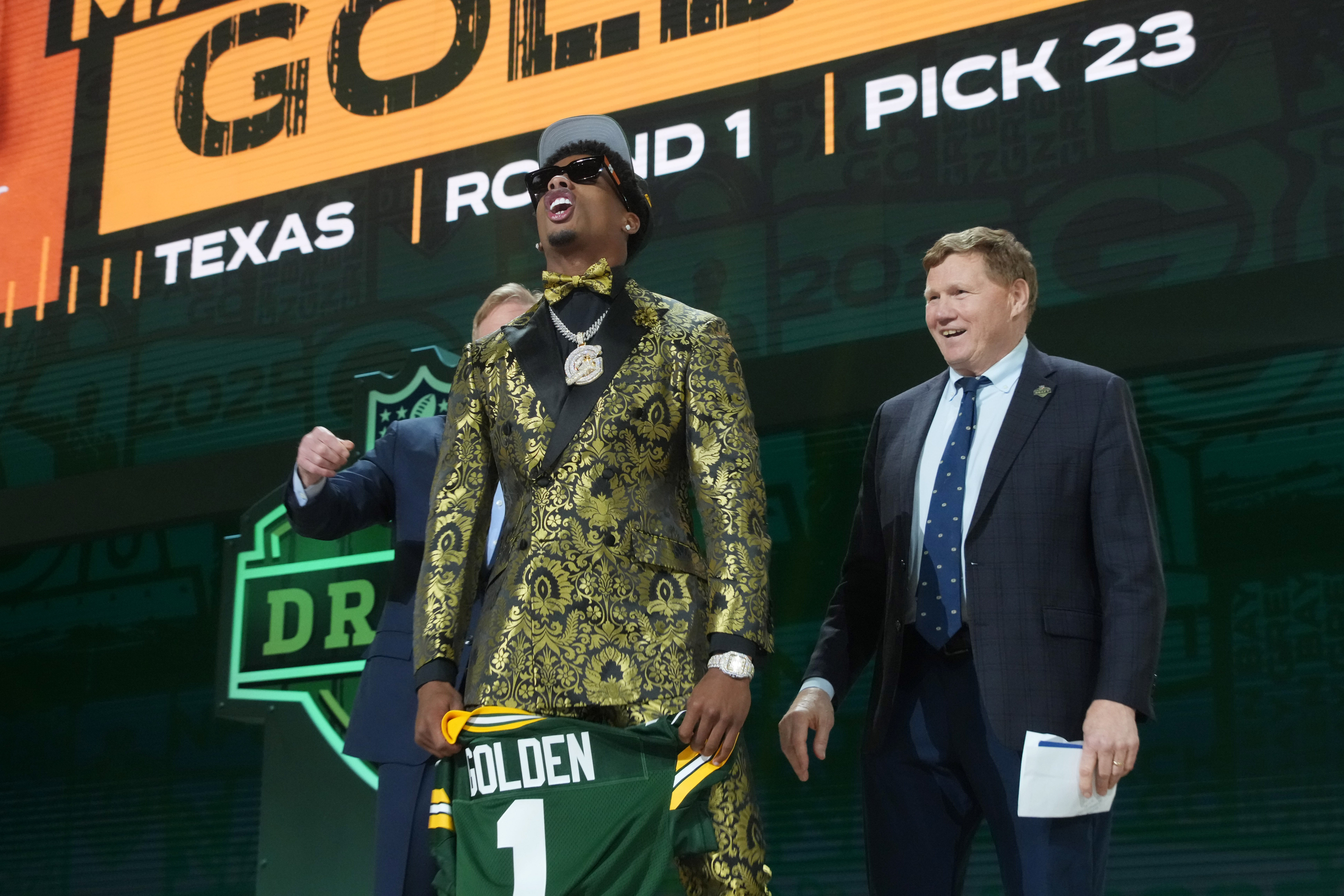 NFL commissioner Roger Goodell and Green Bay Packers president Mark Murphy with Texas Longhorns wide receiver Matthew Golden after he is selected by the Green Bay Packers as the number 23 pick in the first round of the 2025 NFL Draft at Lambeau Field.