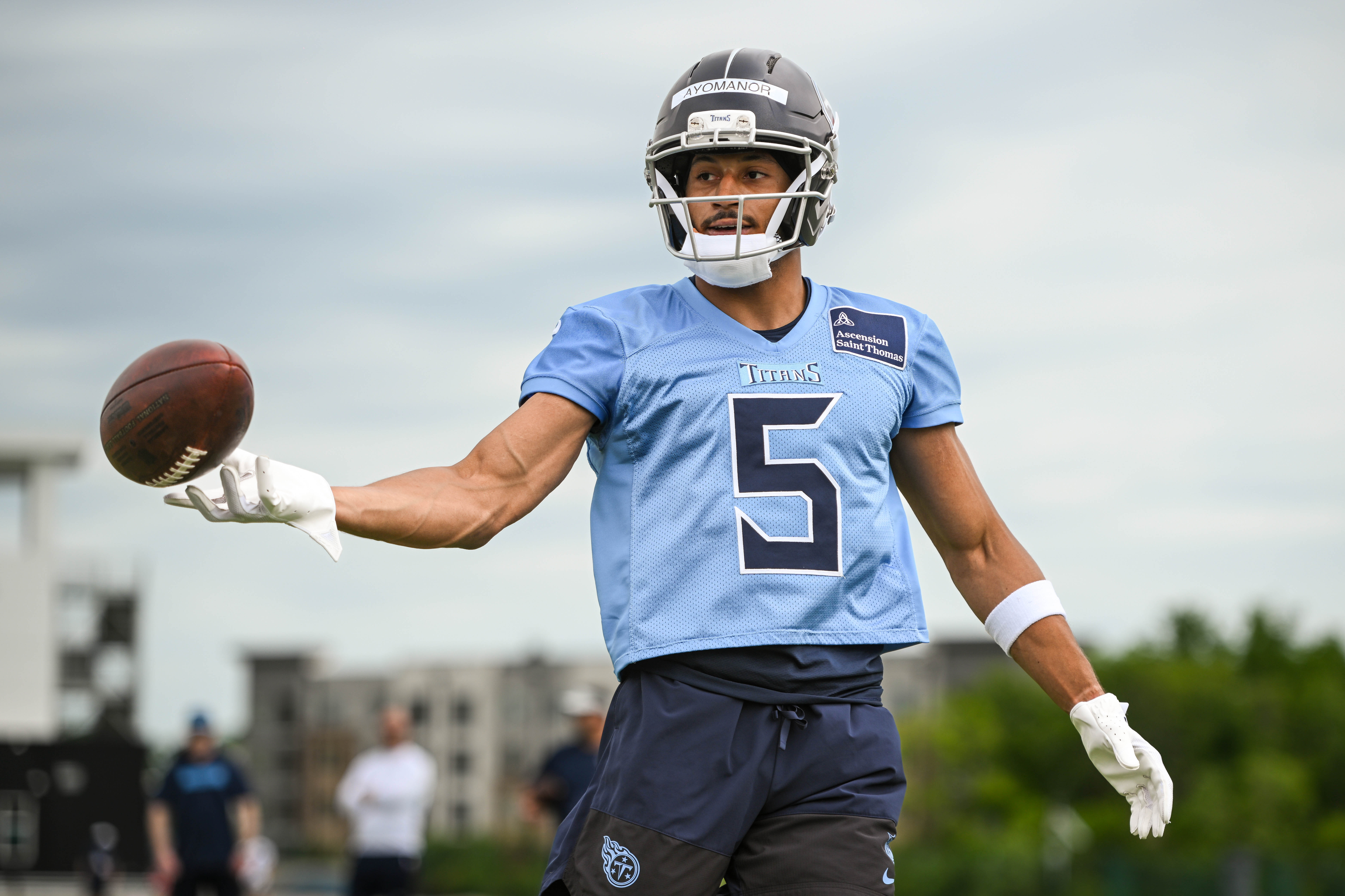 May 10, 2025; Nashville, TN, USA; Tennessee Titans wider receiver Elic Ayomanor (5) makes a catch as he goes through drills during Rookie Mini Camp at Saint Thomas Sports Park. Mandatory Credit: Steve Roberts-Imagn Images