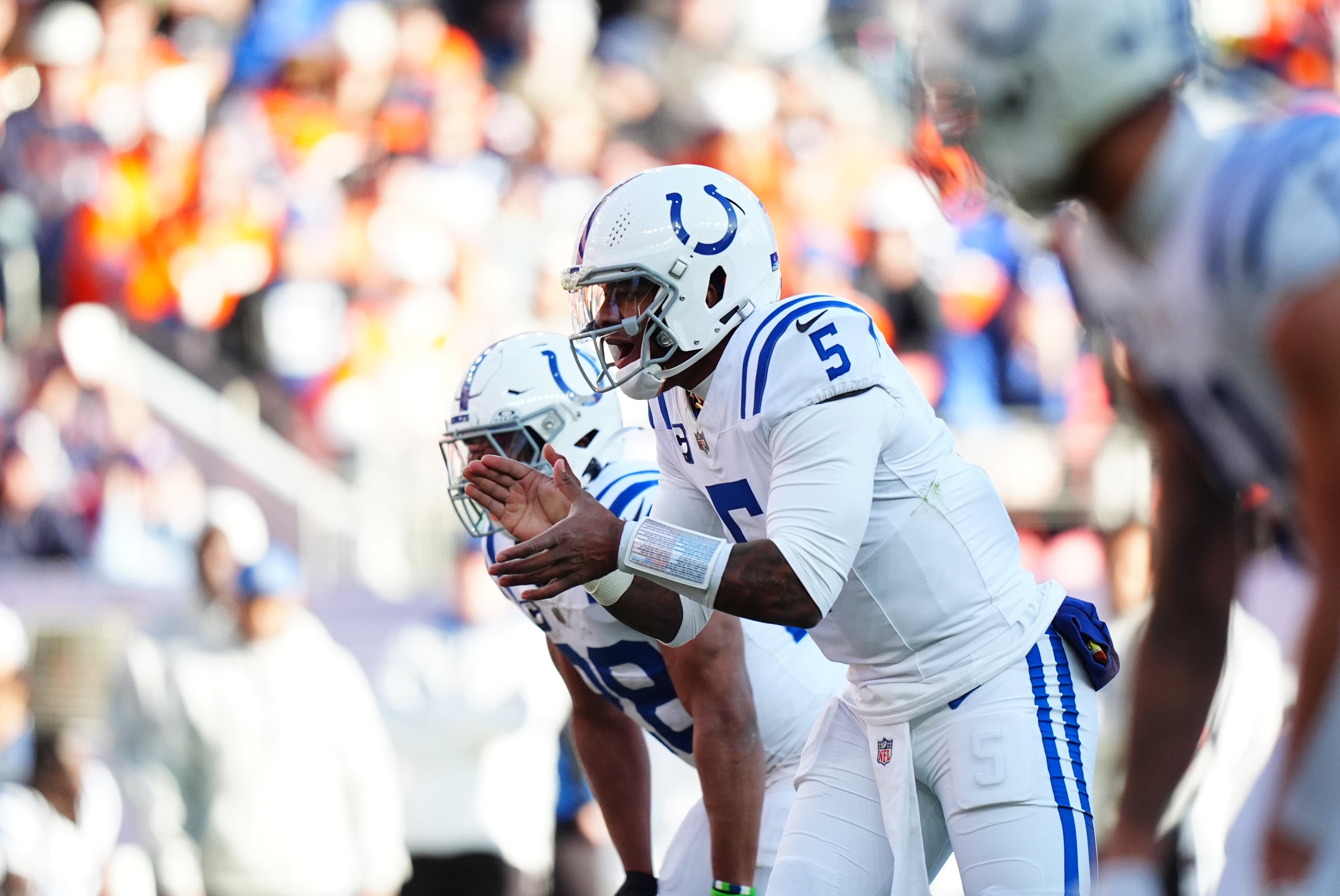 Dec 15, 2024; Denver, Colorado, USA; Indianapolis Colts quarterback Anthony Richardson (5) calls for the ball in the first quarter against the Denver Broncos at Empower Field at Mile High.