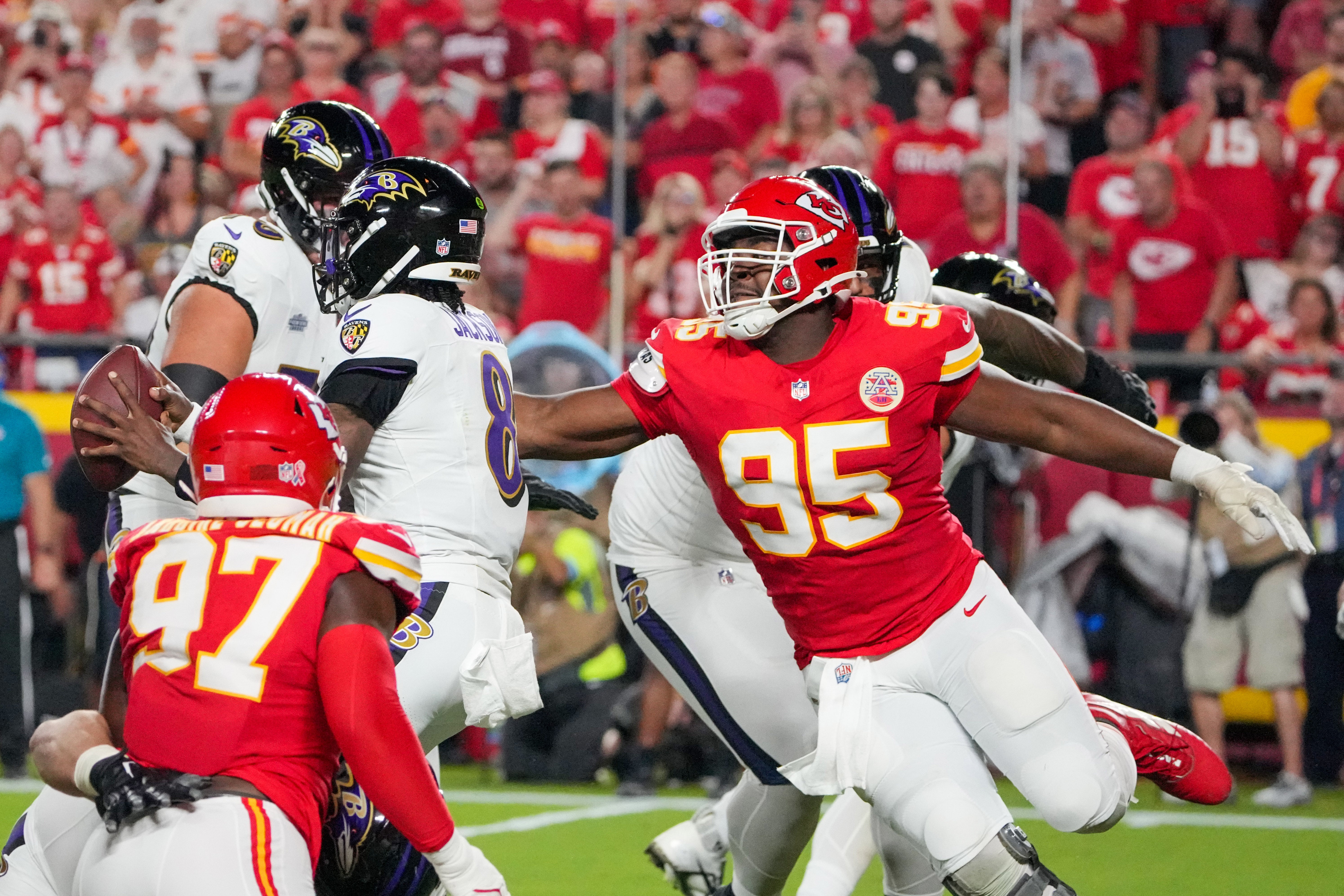 Kansas City Chiefs defensive tackle Chris Jones (95) sacks Baltimore Ravens quarterback Lamar Jackson (8) causing a fumble during the first half at GEHA Field at Arrowhead Stadium. 
