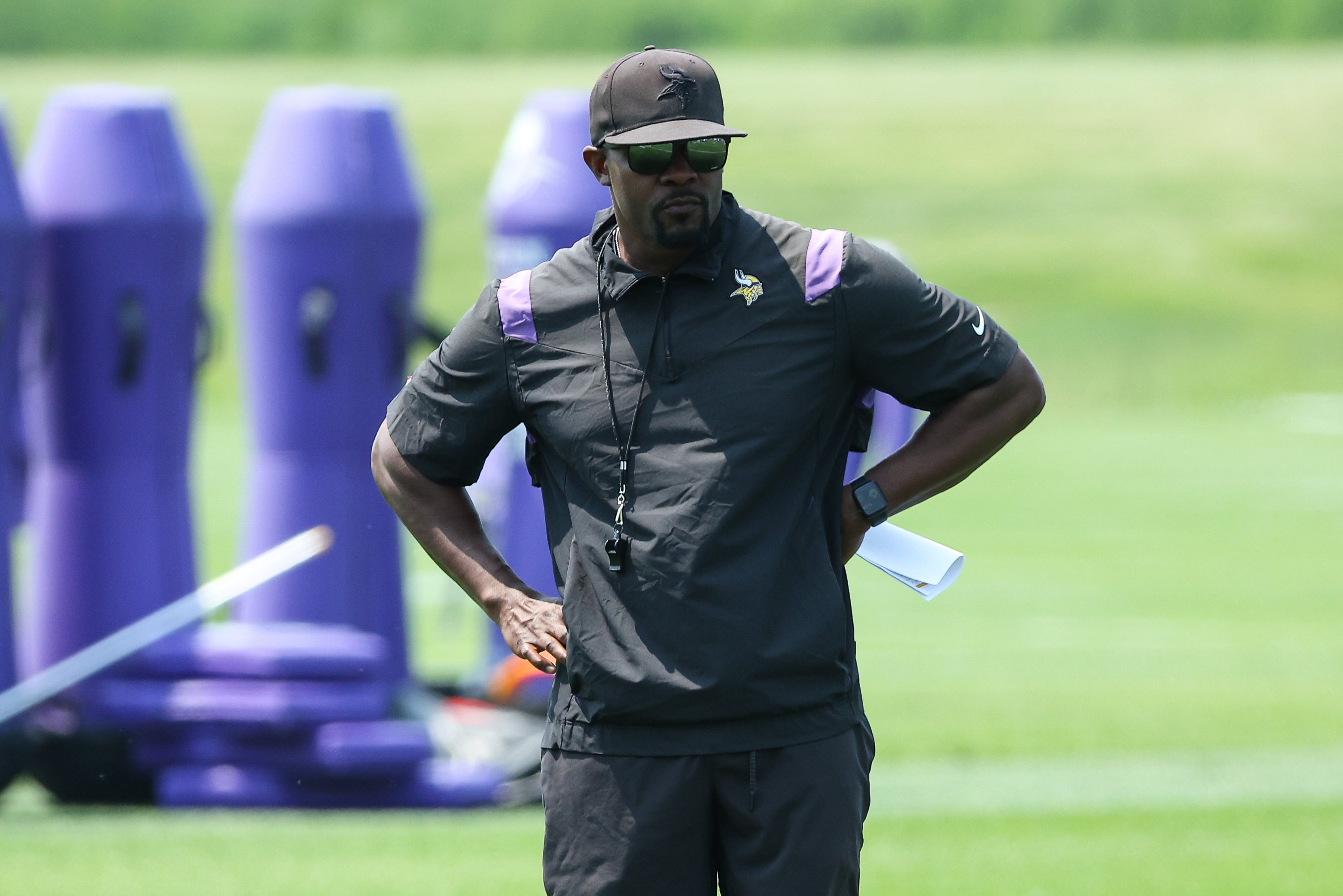 Jun 10, 2025; Minneapolis, MN, USA; Minnesota Vikings defensive coordinator Brian Flores watches practices during minicamp at the Minnesota Vikings Training Facility.