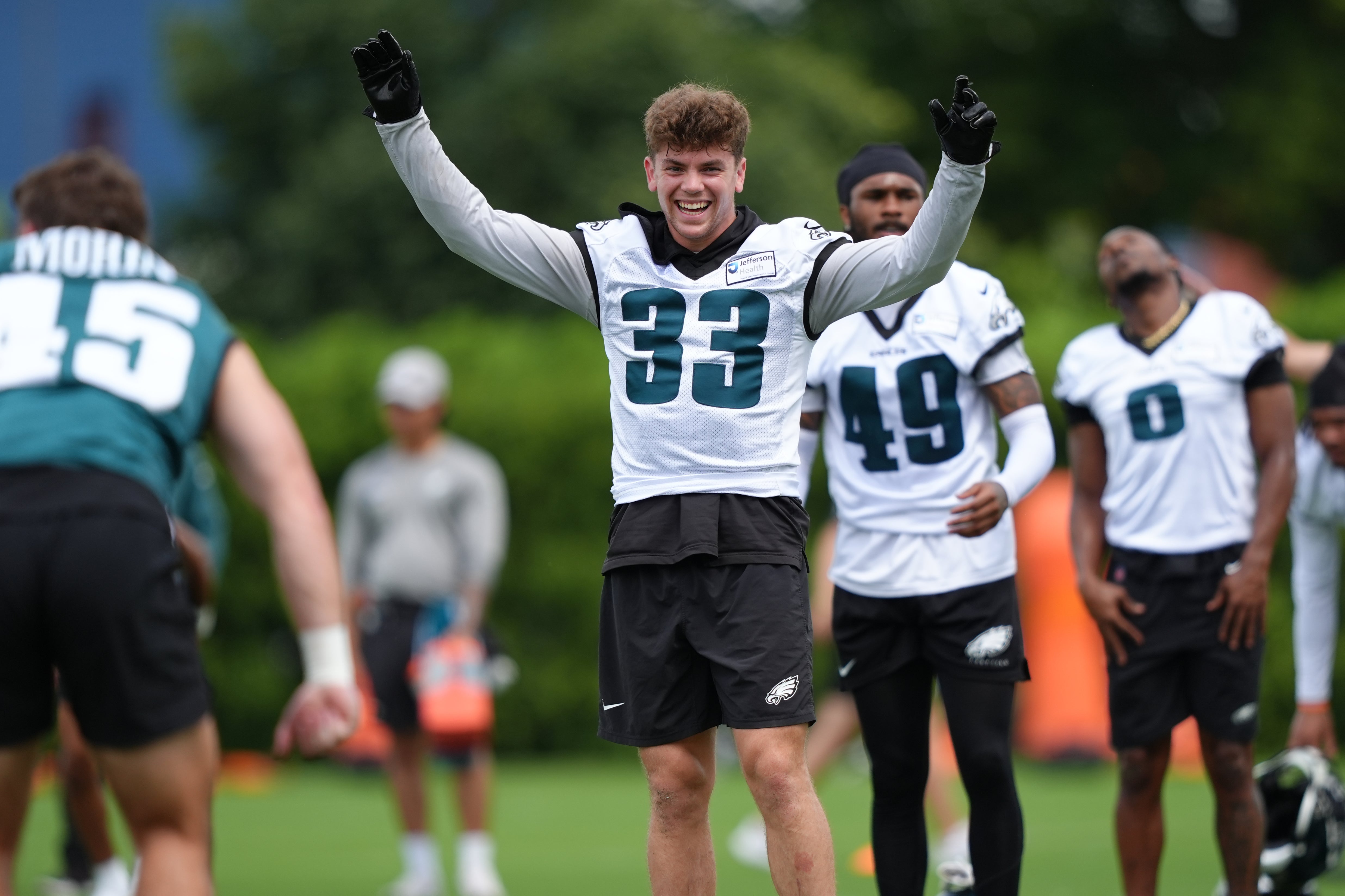 Philadelphia Eagles defensive back Cooper DeJean (33) reacts during warmups before a practice drill at NovaCare Complex.