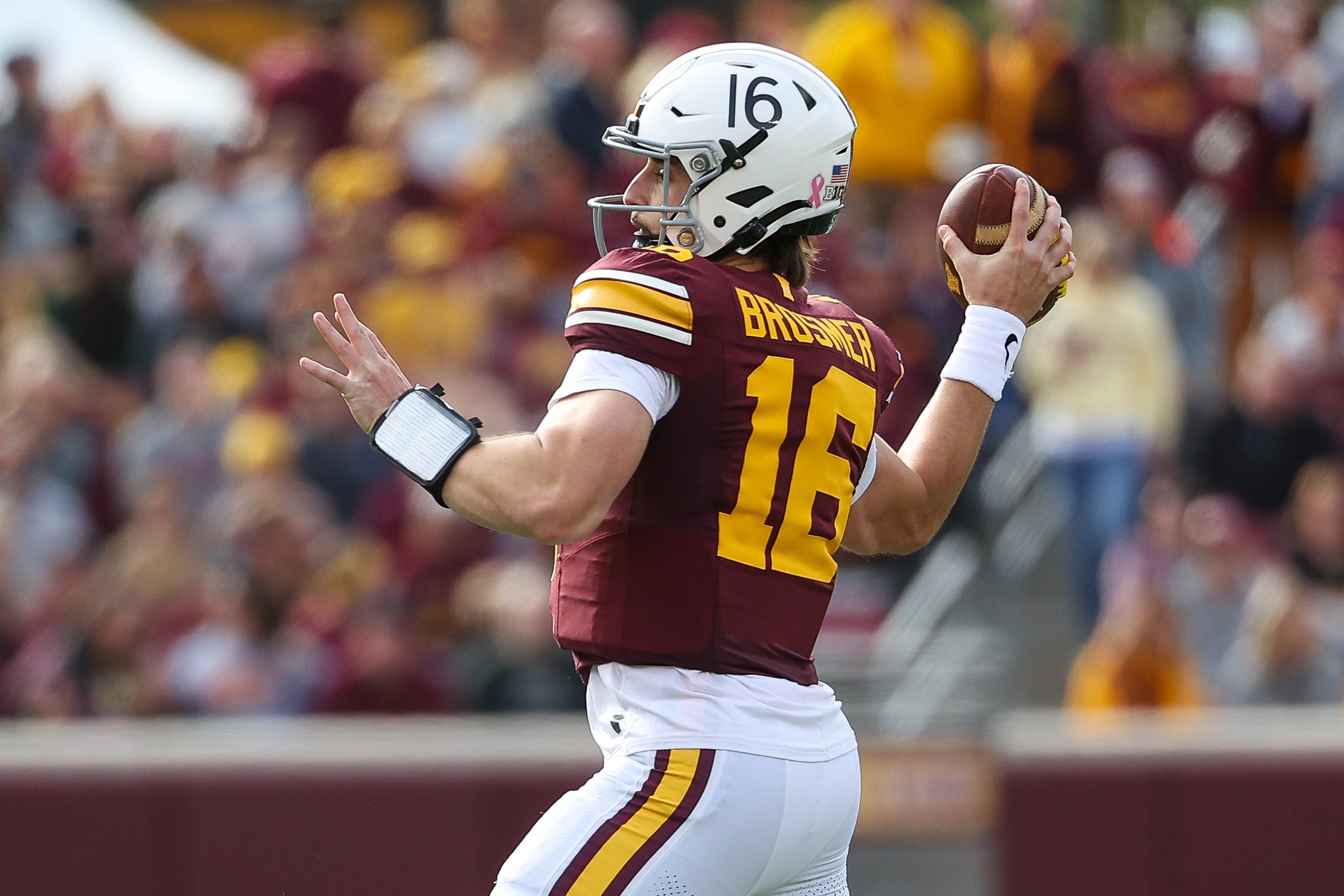 Oct 26, 2024; Minneapolis, Minnesota, USA; Minnesota Golden Gophers quarterback Max Brosmer (16) throws the ball against the Maryland Terrapins during the first half at Huntington Bank Stadium.