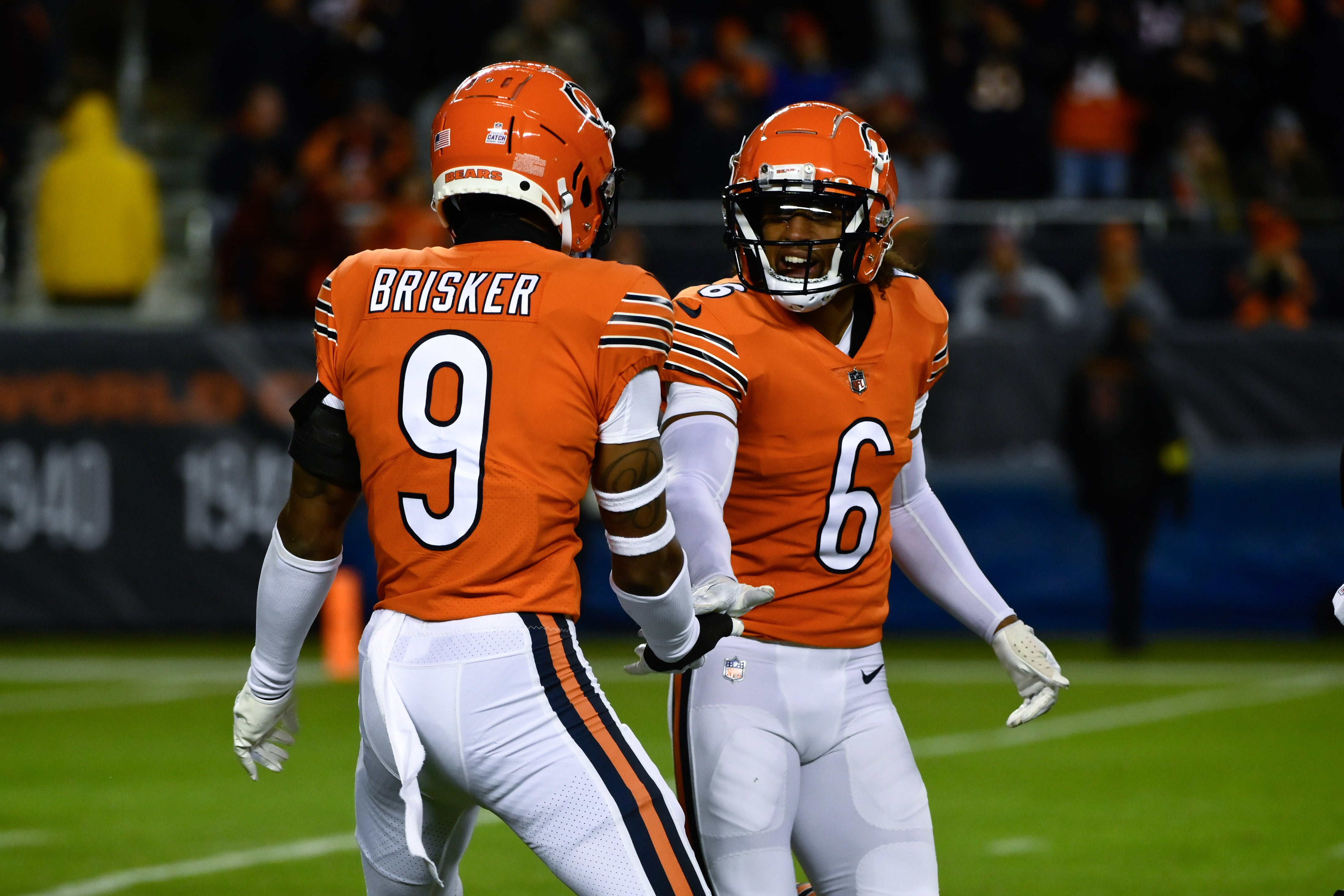 Oct 13, 2022; Chicago, Illinois, USA; Chicago Bears safety Jaquan Brisker (9) and Chicago Bears cornerback Kyler Gordon (6) after Brisker sacked Washington Commanders quarterback Carson Wentz (11) during the first half at Soldier Field.
