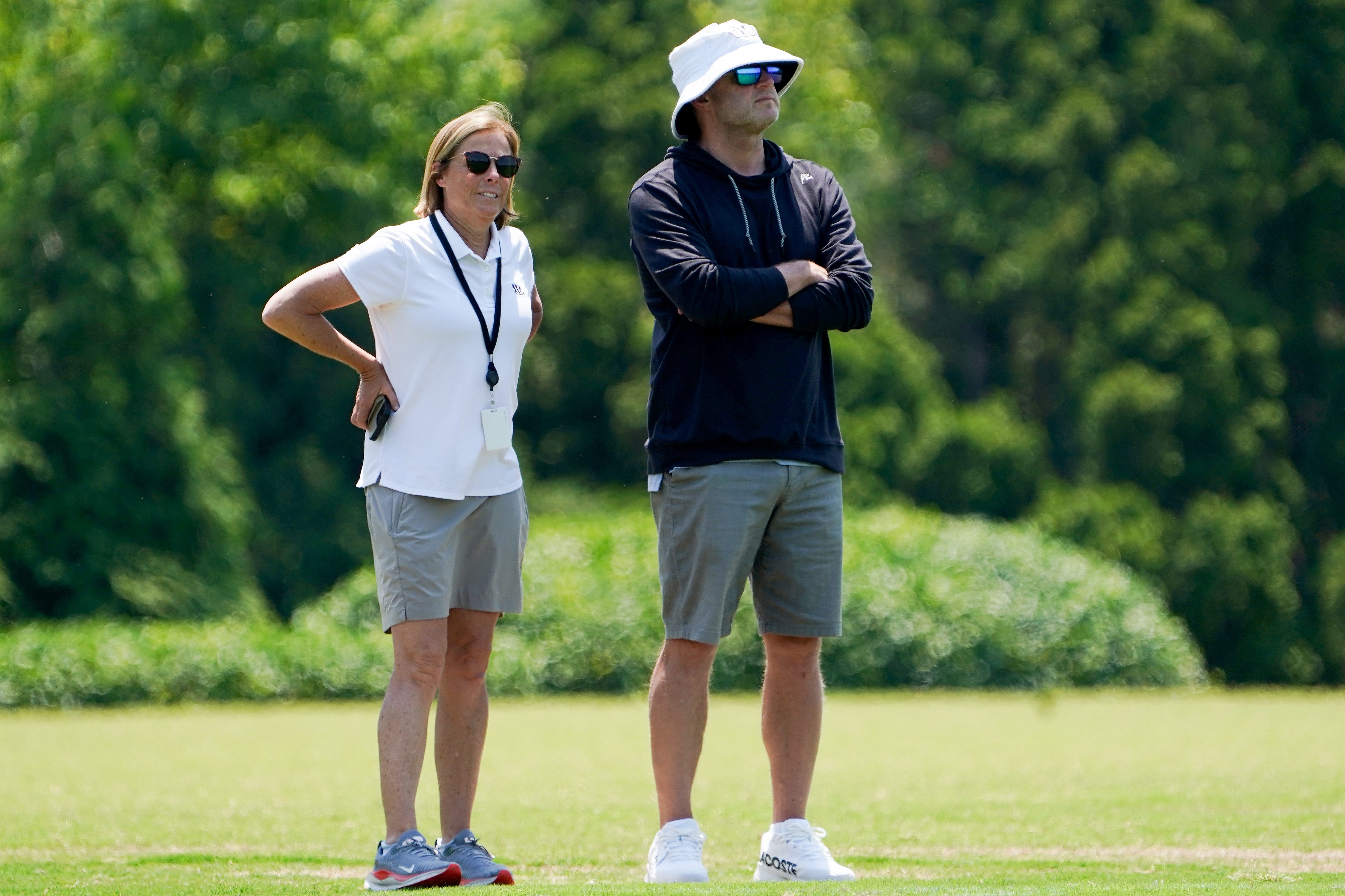 Katie Blackburn, left, and Duke Tobin, right, watch the Cincinnati Bengals practice, Wednesday, June 11, 2025, at Kettering Health Practice Fields in Downtown Cincinnati.