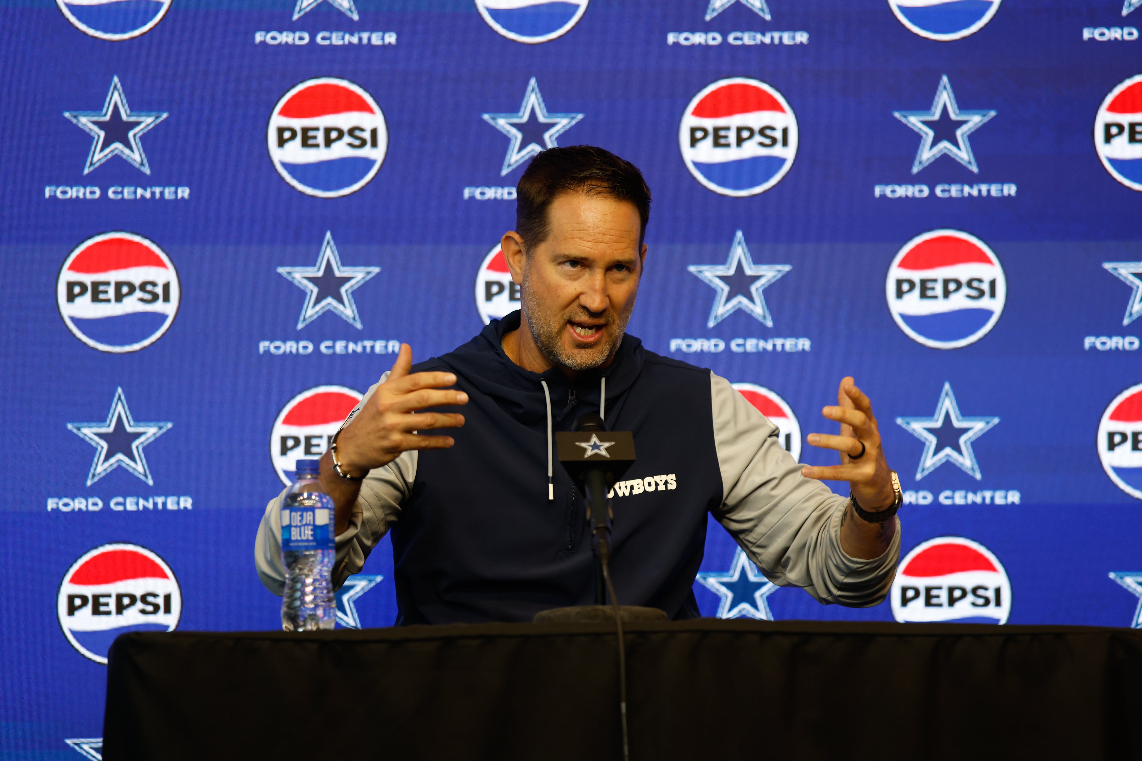 Dallas Cowboys head coach Brian Schottenheimer addresses the media before practice at the Ford Center at the Star Training Facility in Frisco, Texas.