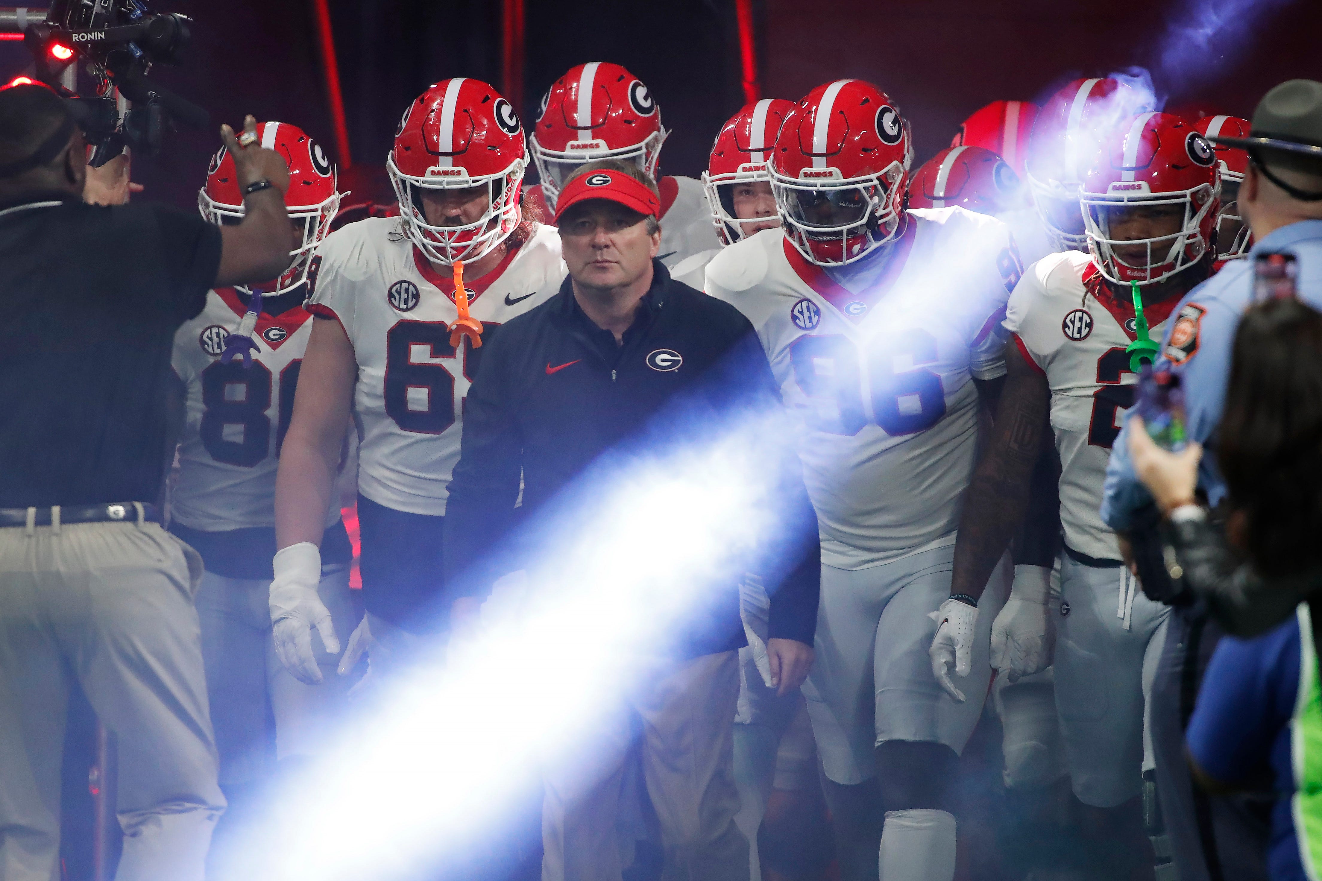Georgia coach Kirby Smart leads his team onto the field before the start of the SEC Championship game against Alabama at Mercedes-Benz Stadium in Atlanta, on Saturday, Dec. 2, 2023