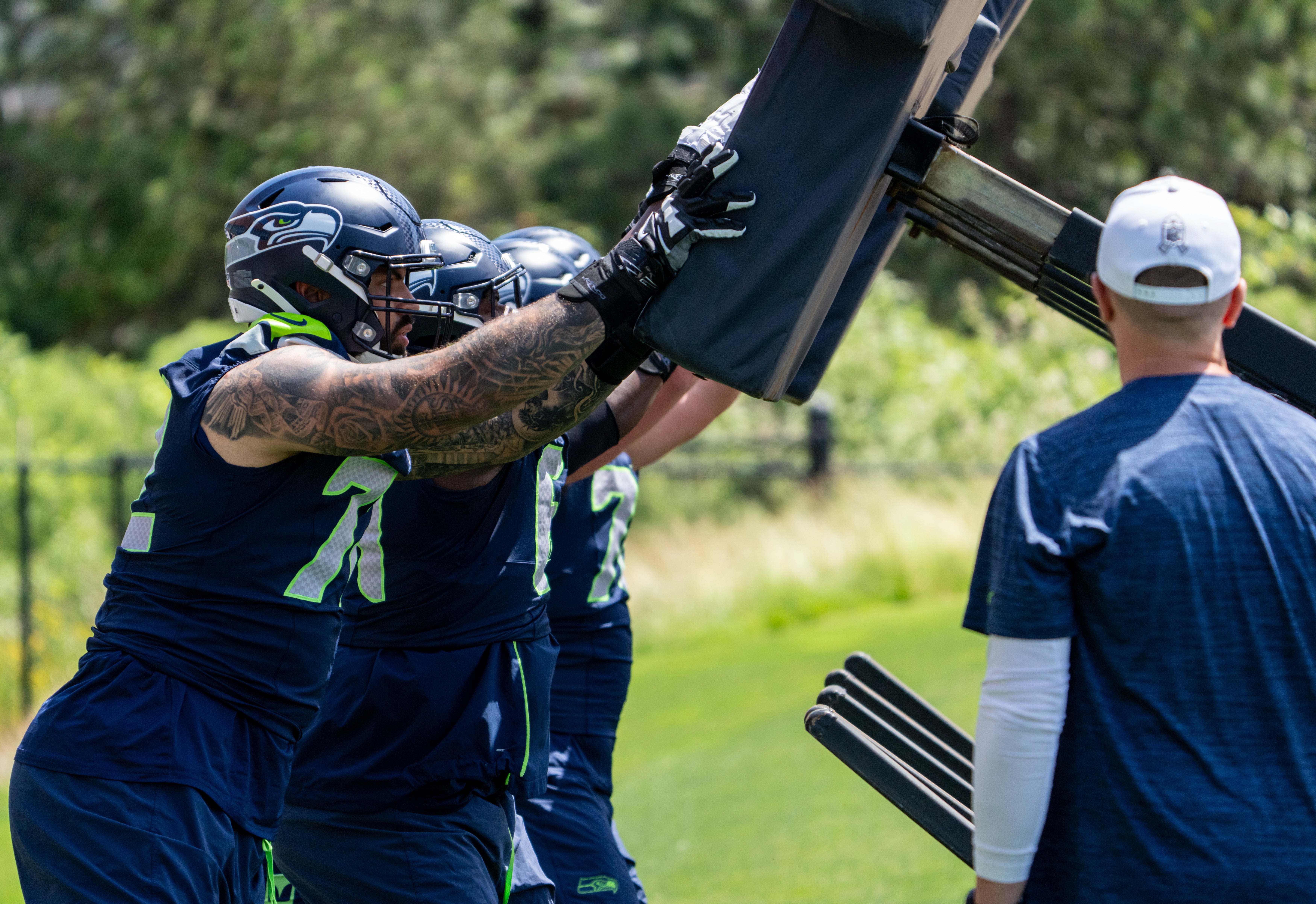 Jun 11, 2025; Renton, WA, USA; Seattle Seahawks offensive linemen including Abraham Lucas (72) take part in drills during mini-camp at Virginia Mason Athletic Center.