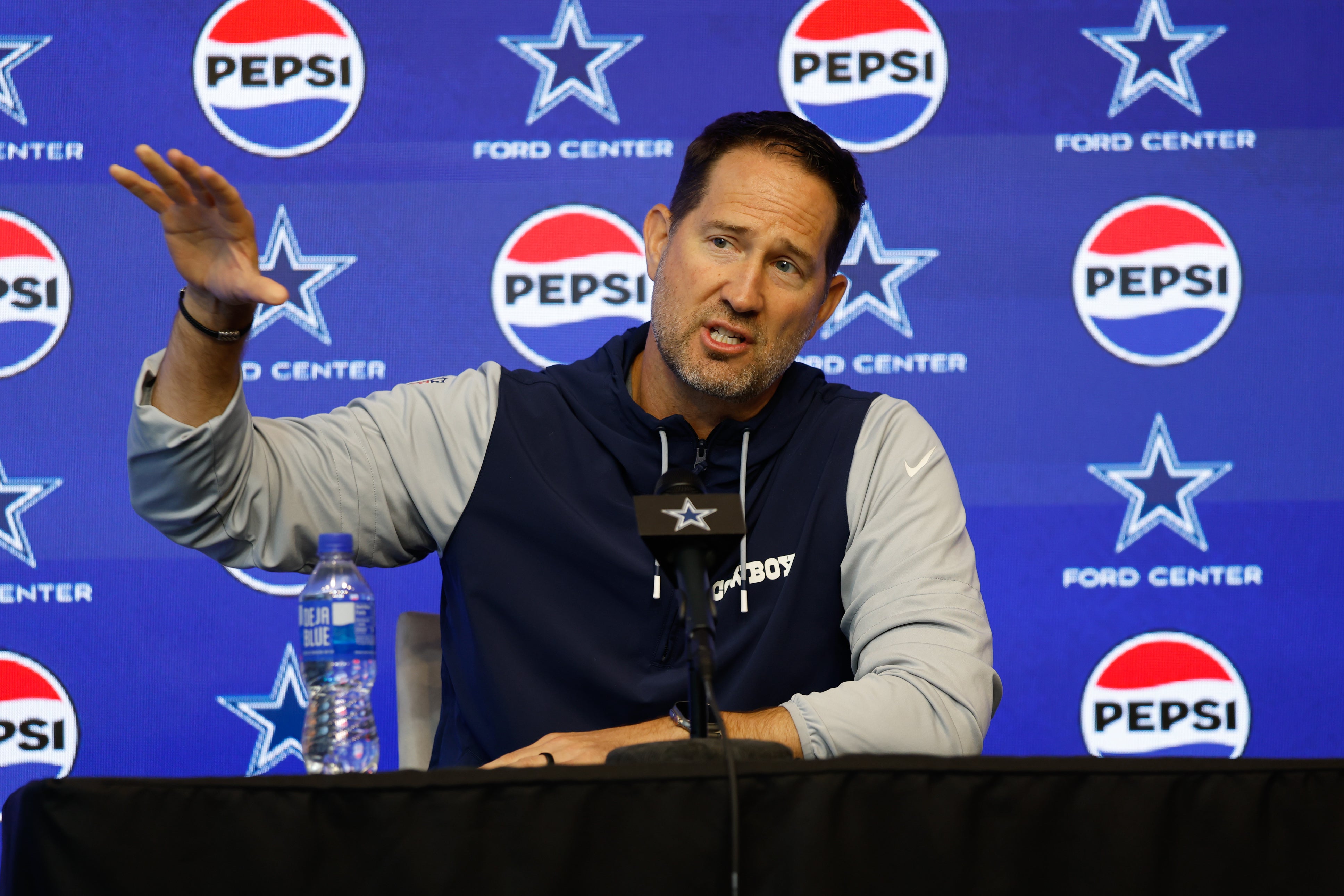 Jun 10, 2025; Arlington, TX, USA; Dallas Cowboys head coach Brian Schottenheimer addresses the media before practice at the Ford Center at the Star Training Facility in Frisco, Texas.