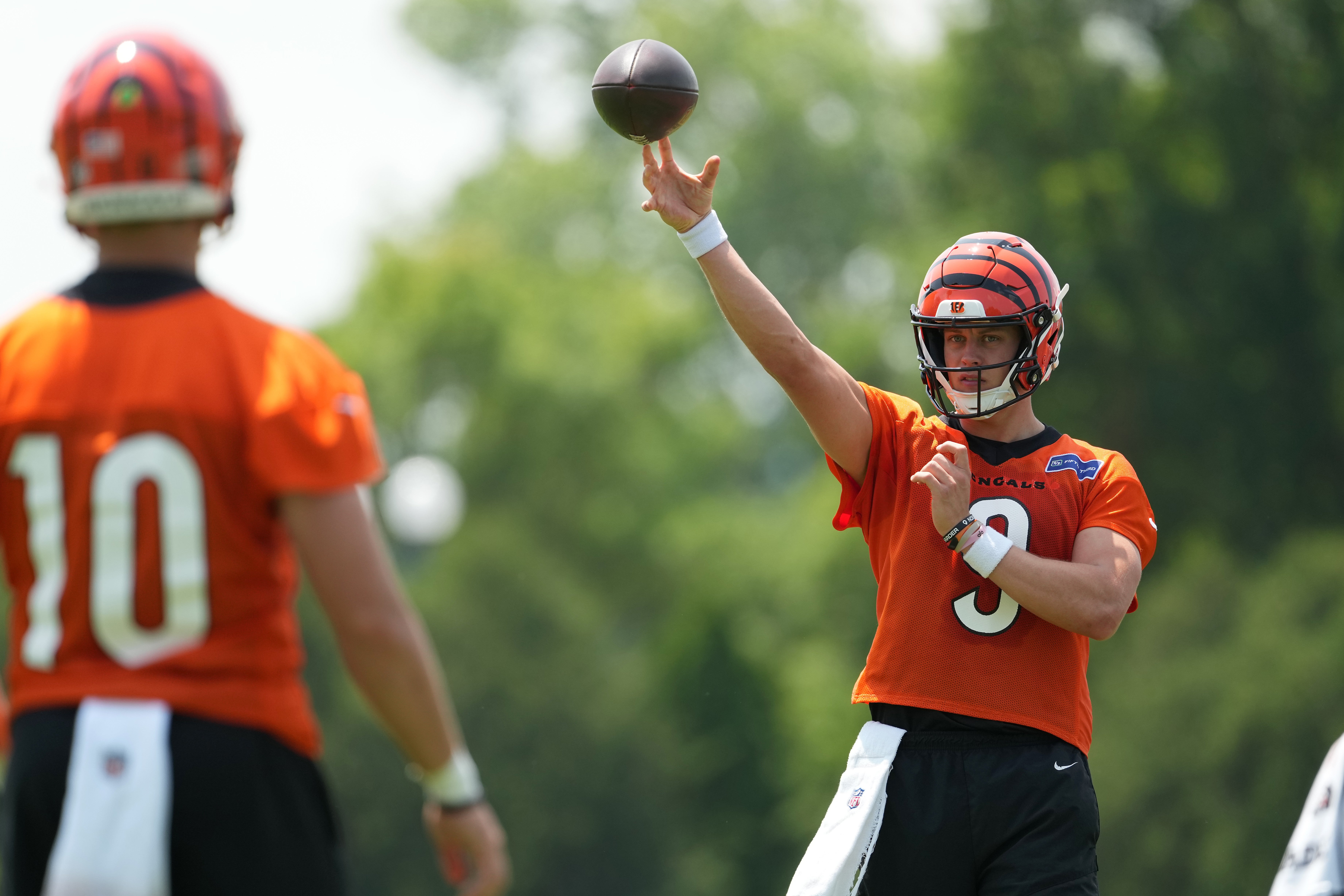 Jun 10, 2025; Cincinnati, OH, USA; Cincinnati Bengals quarterback Joe Burrow (9) throws to quarterback Payton Thorne (10) during practice at Paycor Stadium.