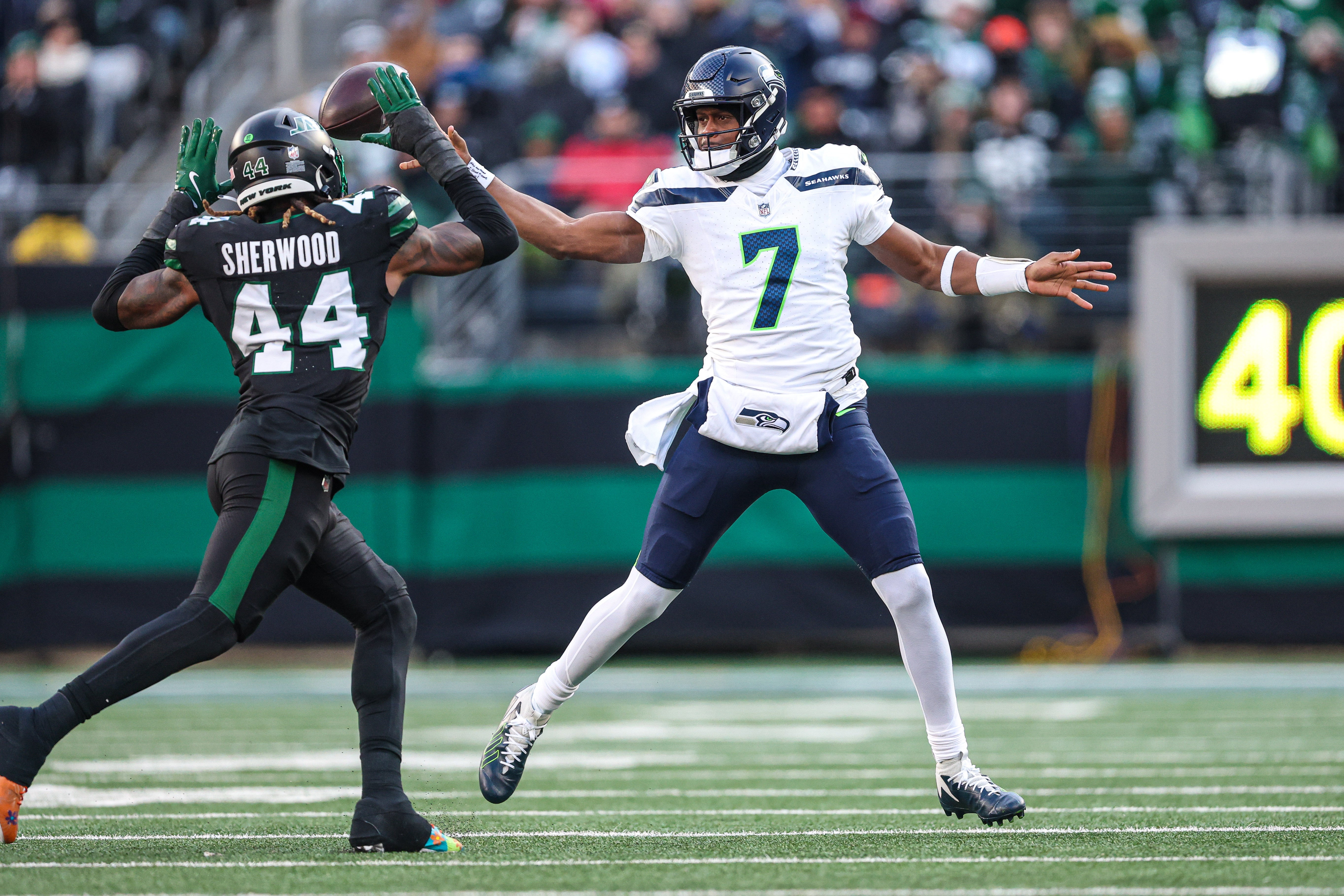 New York Jets linebacker Jamien Sherwood (44) knocks down a pass by Seattle Seahawks quarterback Geno Smith (7) during the first half at MetLife Stadium.