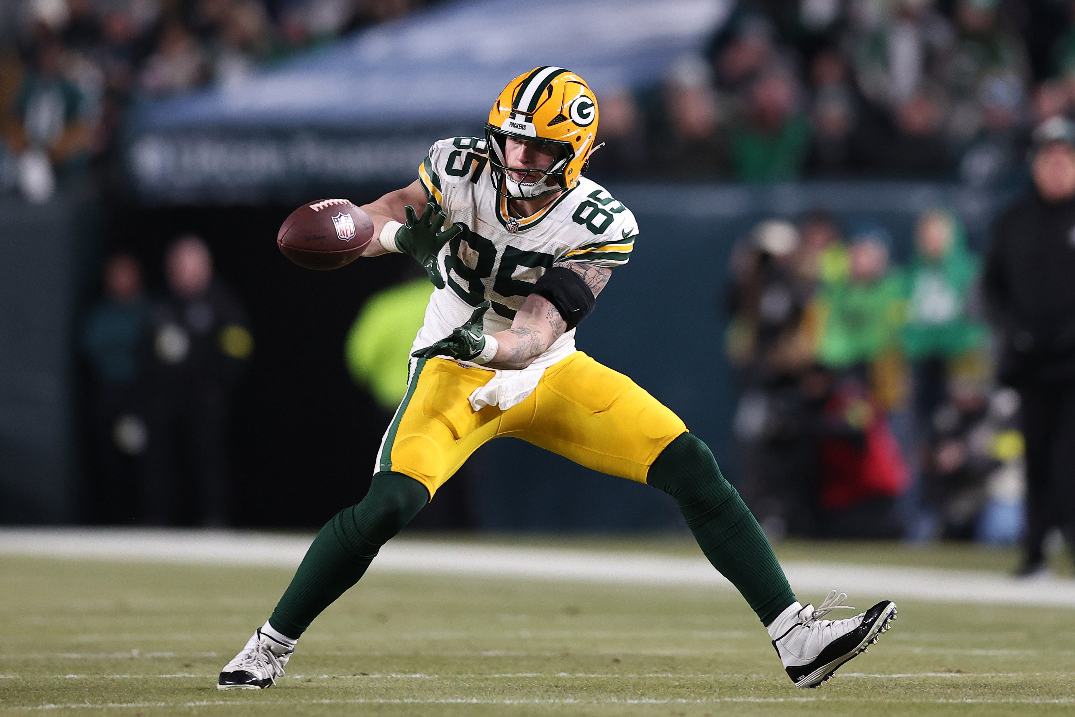 Jan 12, 2025; Philadelphia, Pennsylvania, USA; Green Bay Packers tight end Tucker Kraft (85) makes a catch against the Philadelphia Eagles during the third quarter in an NFC wild card game at Lincoln Financial Field.