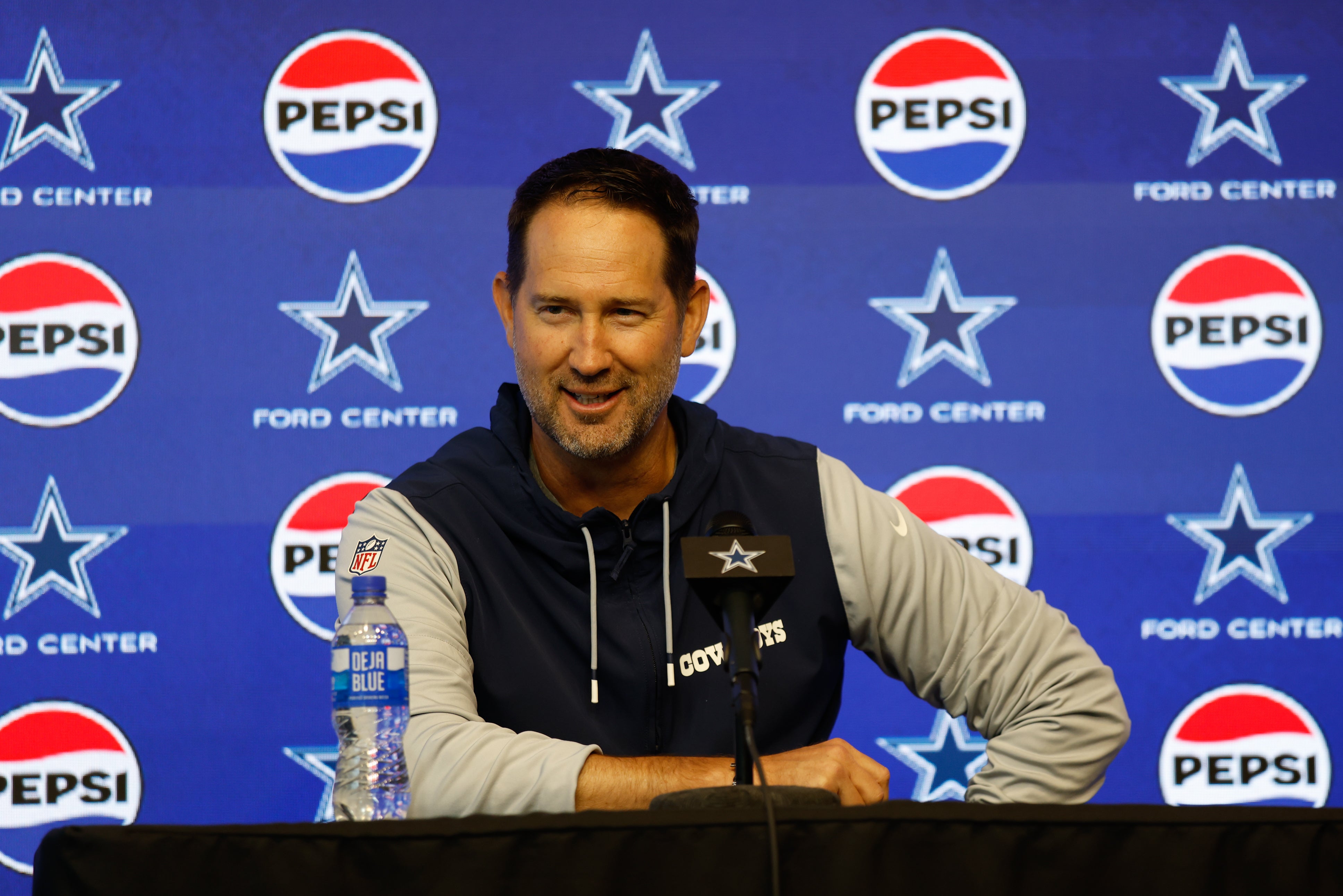 Dallas Cowboys head coach Brian Schottenheimer addresses the media before practice at the Ford Center at the Star Training Facility in Frisco, Texas.