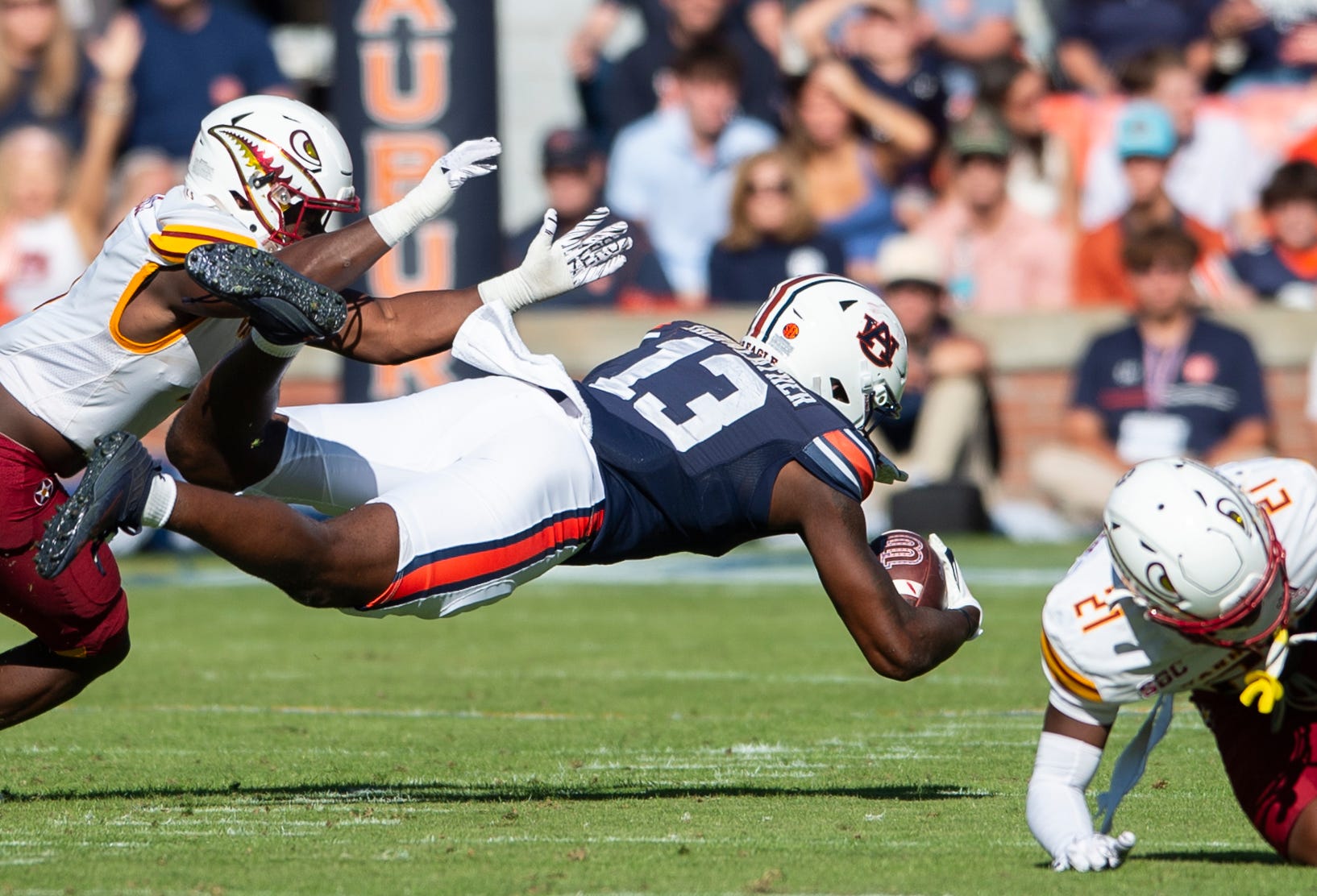 Auburn Tigers tight end Rivaldo Fairweather (13) dives for extra yards after a catch as Auburn Tigers take on Louisiana-Monroe Warhawks at Jordan-Hare Stadium in Auburn, Ala., on Saturday, Nov. 16, 2024. Auburn Tigers lead Louisiana-Monroe Warhawks 24-0 at halftime.
