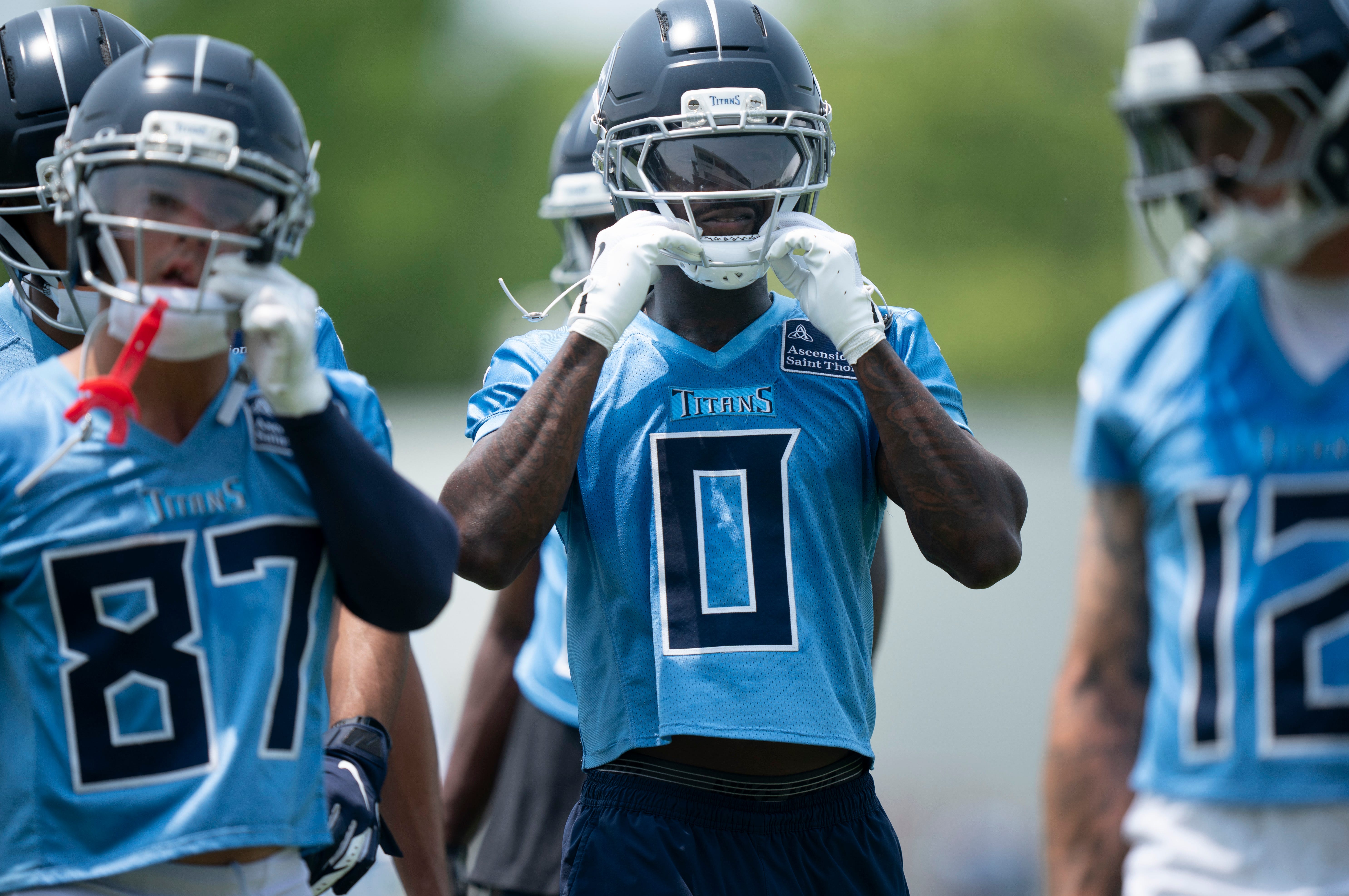 Tennessee Titans wide receiver Calvin Ridley (0) straps on his helmet for drills during mandatory Titans Minicamp at Ascension Saint Thomas Sports Park in Nashville, Tenn., Tuesday, June 10, 2025.
