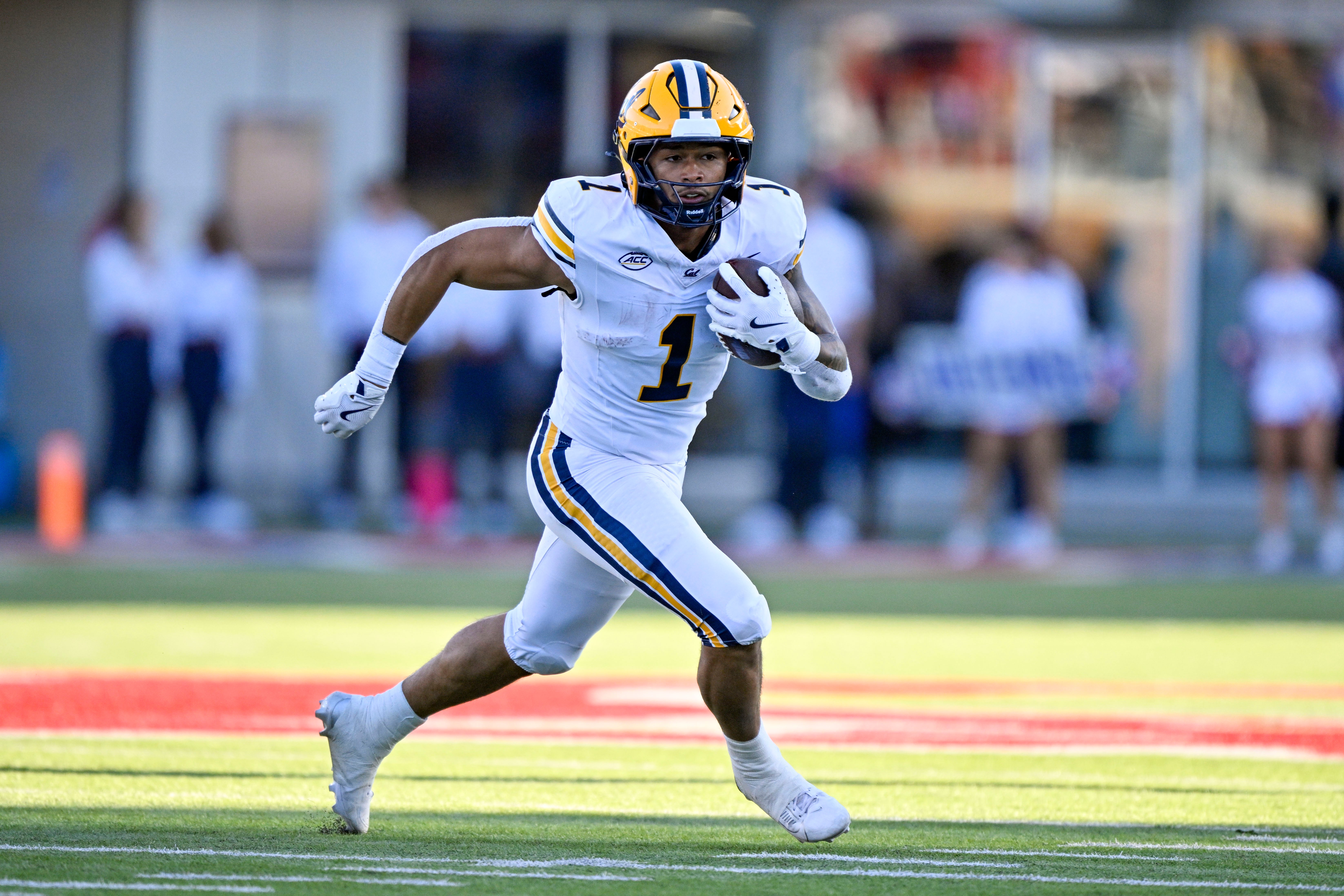 Nov 30, 2024; Dallas, Texas, USA; California Golden Bears running back Jaydn Ott (1) runs with the ball against the Southern Methodist Mustangs during the first half at Gerald J. Ford Stadium.
