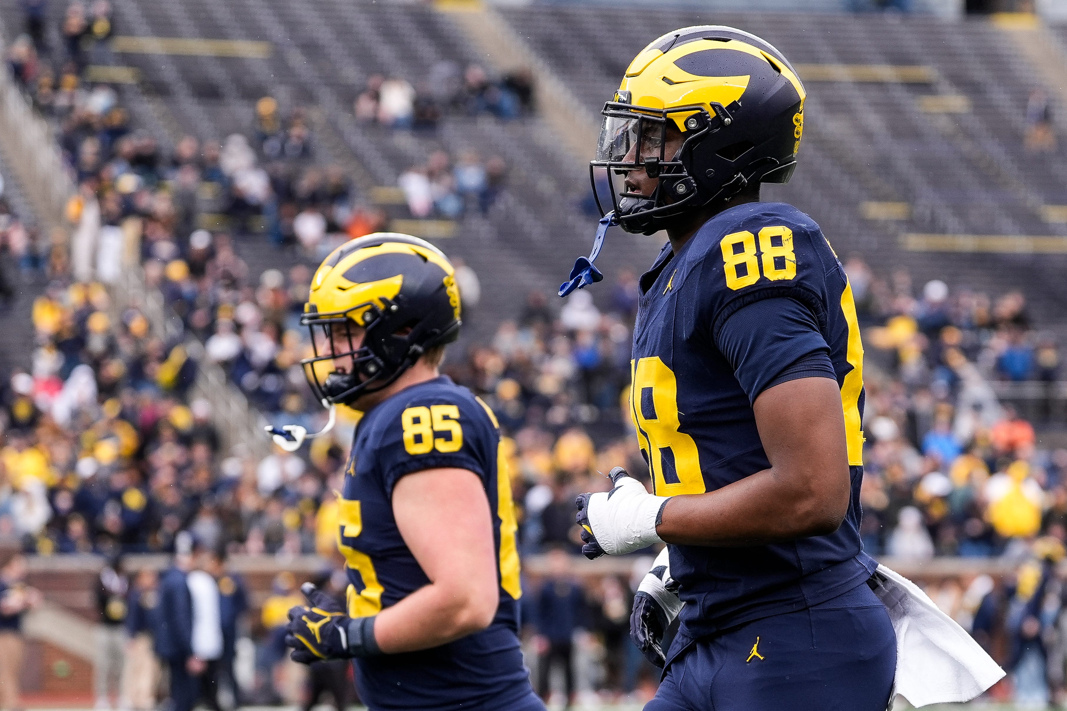 Michigan wide receiver Jamar Browder (88), right, and defensive lineman Ted Hammond (85) warm up before the spring game at Michigan Stadium in Ann Arbor on Saturday, April 19, 2025.