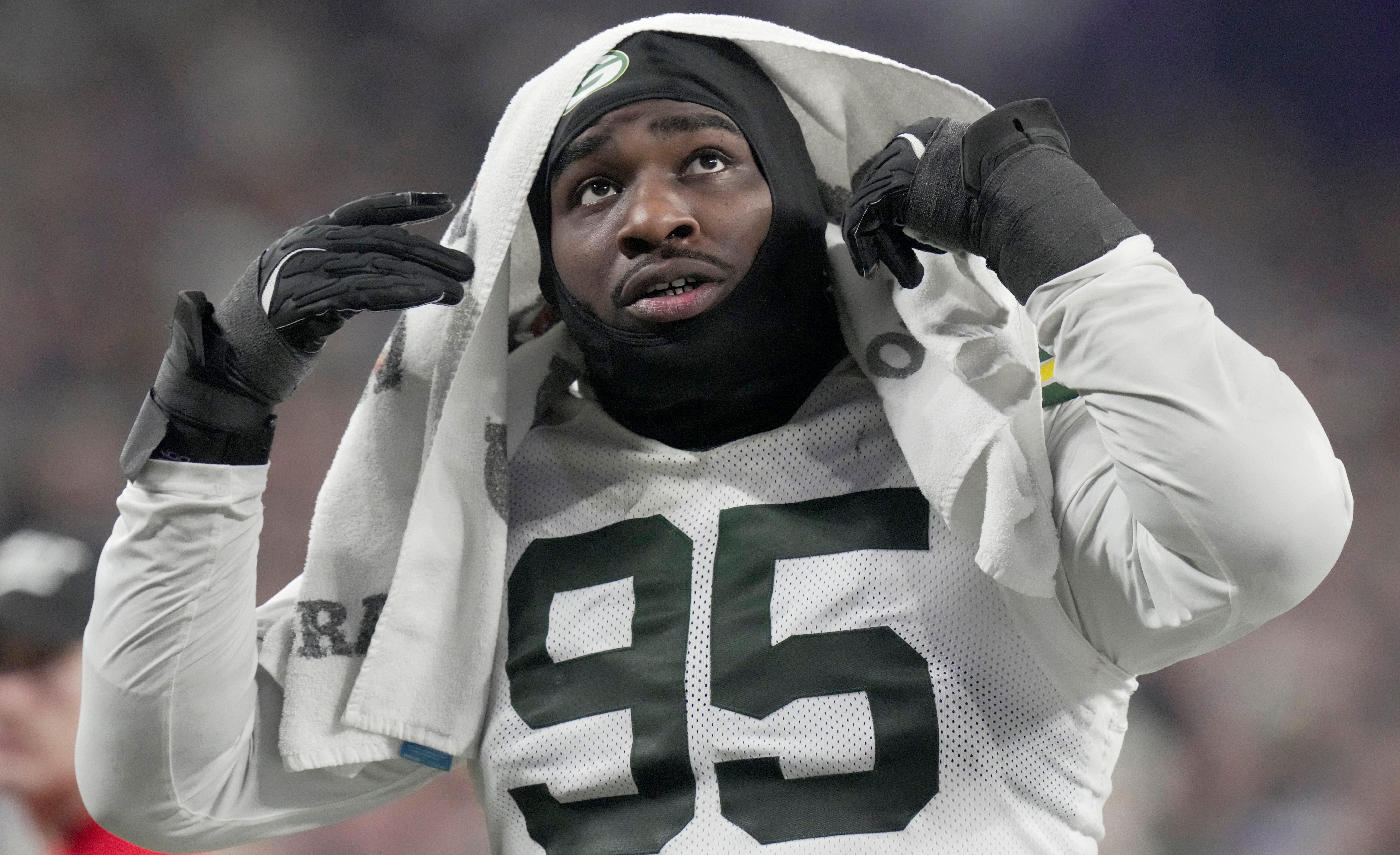 Green Bay Packers defensive tackle Devonte Wyatt (95) heads to the locker room during the third quarter of their game Sunday, December 29, 2024 at U.S. Bank Stadium in Minneapolis, Minnesota. The Minnesota Vikings beat the Green Bay Packers 27-25.