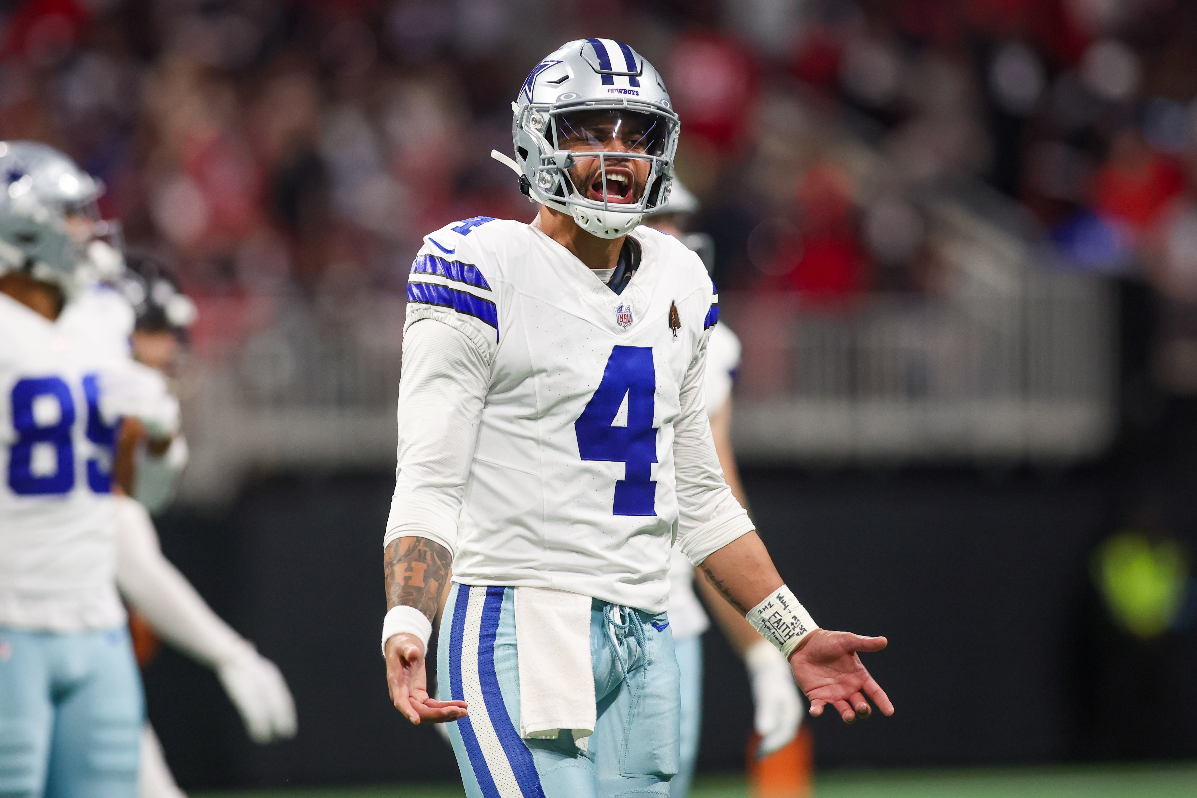 Dallas Cowboys quarterback Dak Prescott (4) reacts to a penalty against the Atlanta Falcons in the third quarter at Mercedes-Benz Stadium.