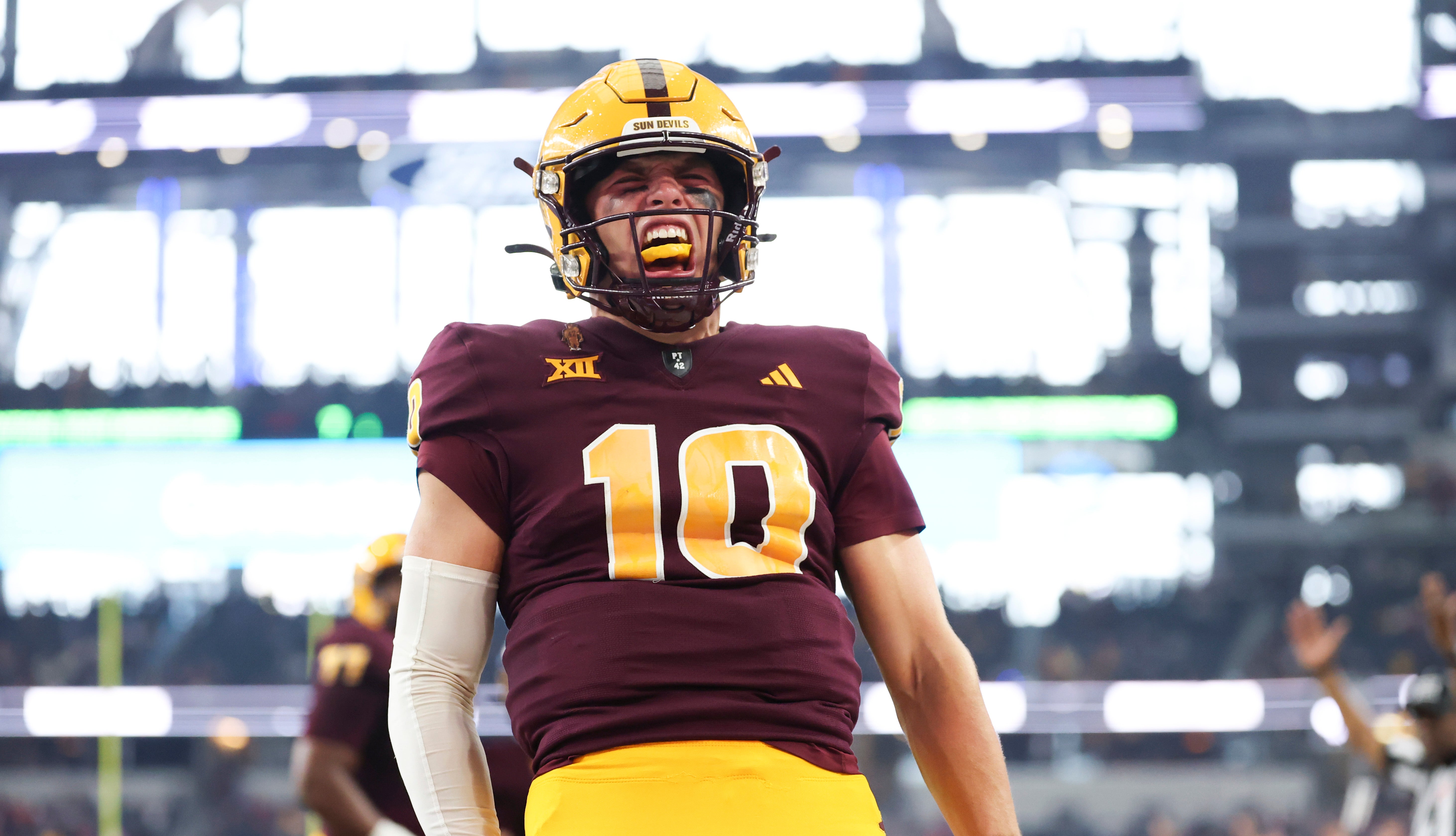 Dec 7, 2024; Arlington, TX, USA; Arizona State Sun Devils quarterback Sam Leavitt (10) reacts after running for a touchdown during the first quarter against the Iowa State Cyclones at AT&T Stadium.