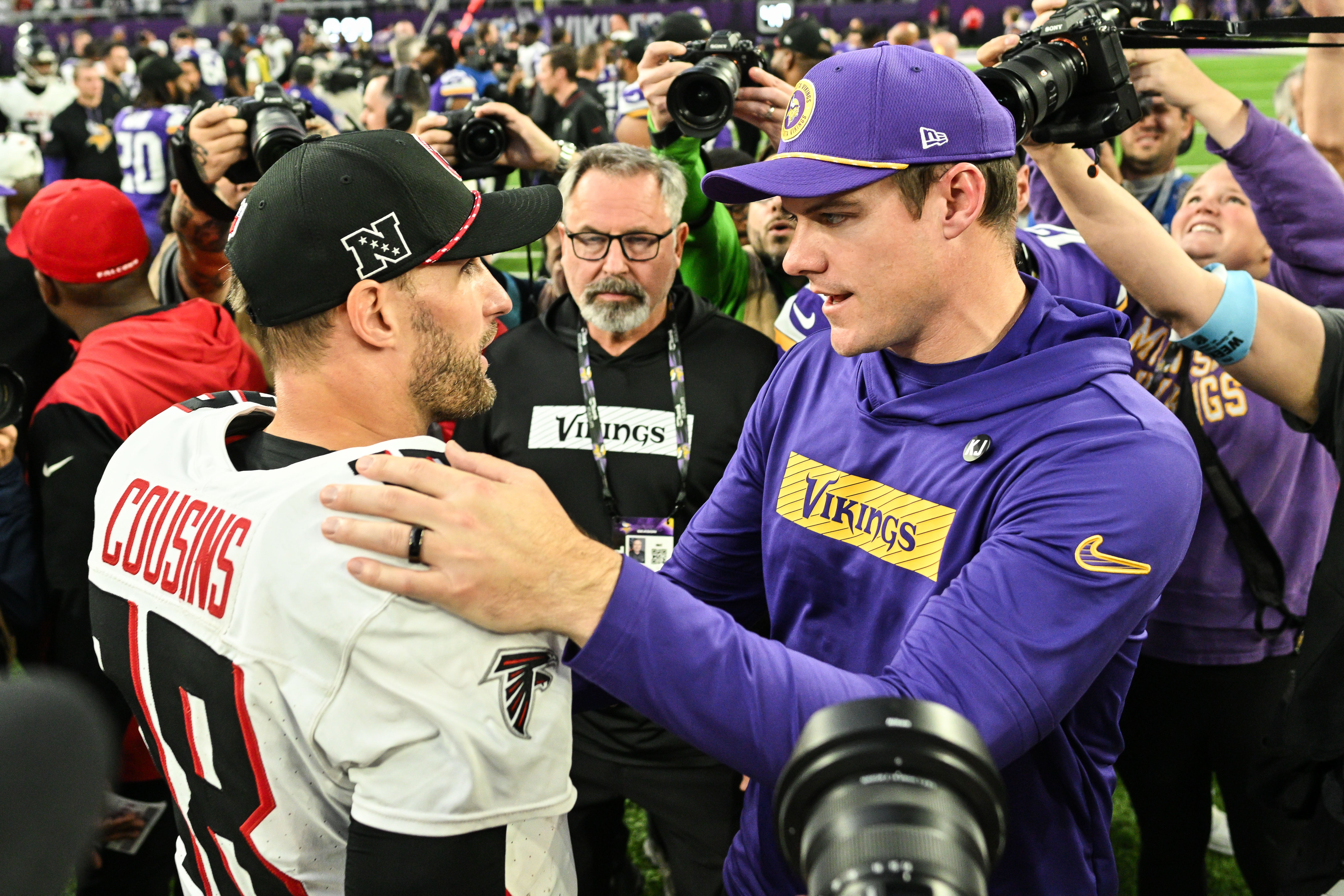 Dec 8, 2024; Minneapolis, Minnesota, USA; Atlanta Falcons quarterback Kirk Cousins (18) and Minnesota Vikings head coach Kevin O'Connell talk after the game at U.S. Bank Stadium.