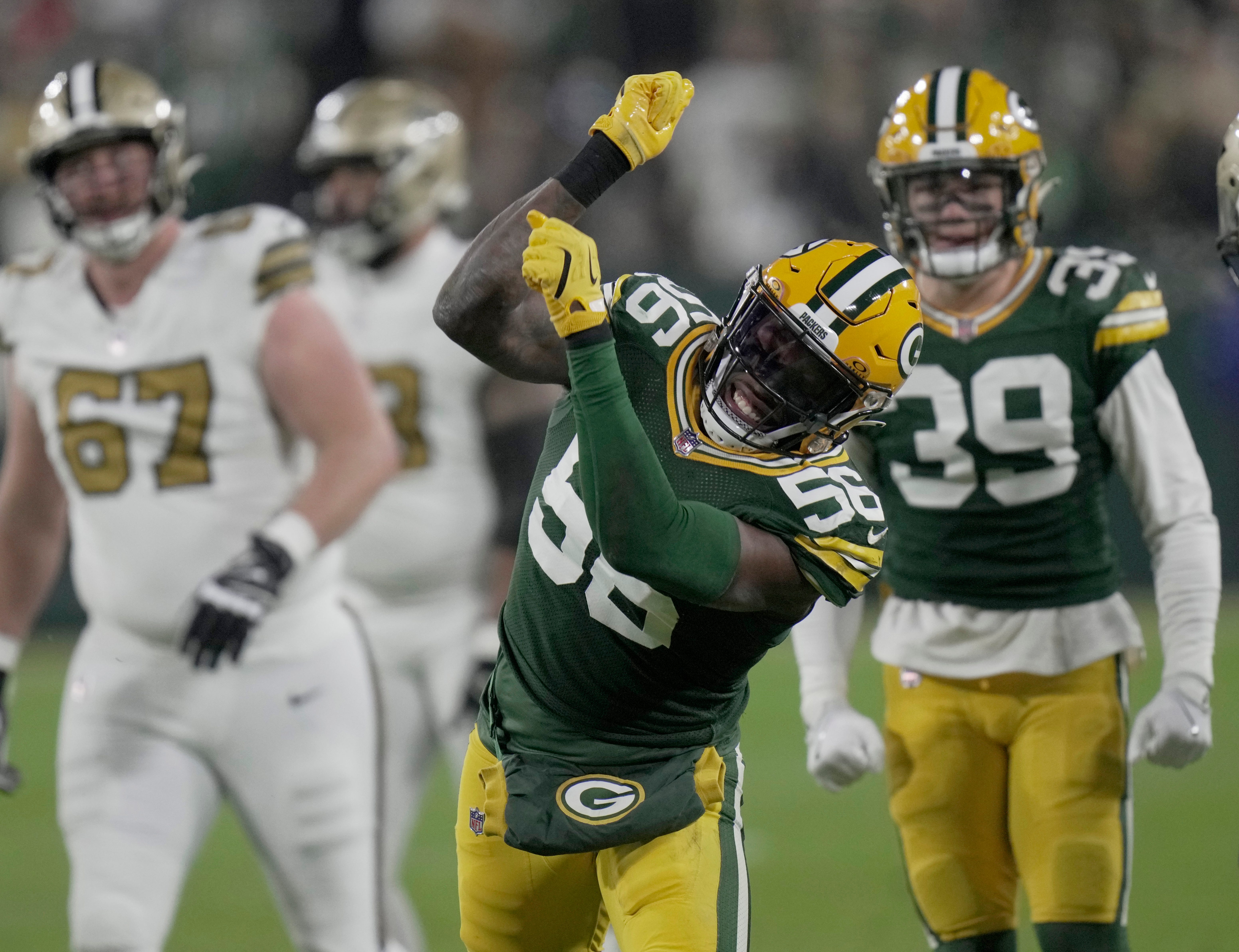 Green Bay Packers linebacker Edgerrin Cooper (56) celebrates a tackle for a three-yard loss during the second quarter of their game Monday, December 23, 2024 at Lambeau Field in Green Bay, Wisconsin. The Green Bay Packers beat the New Orleans Saints 34-0.