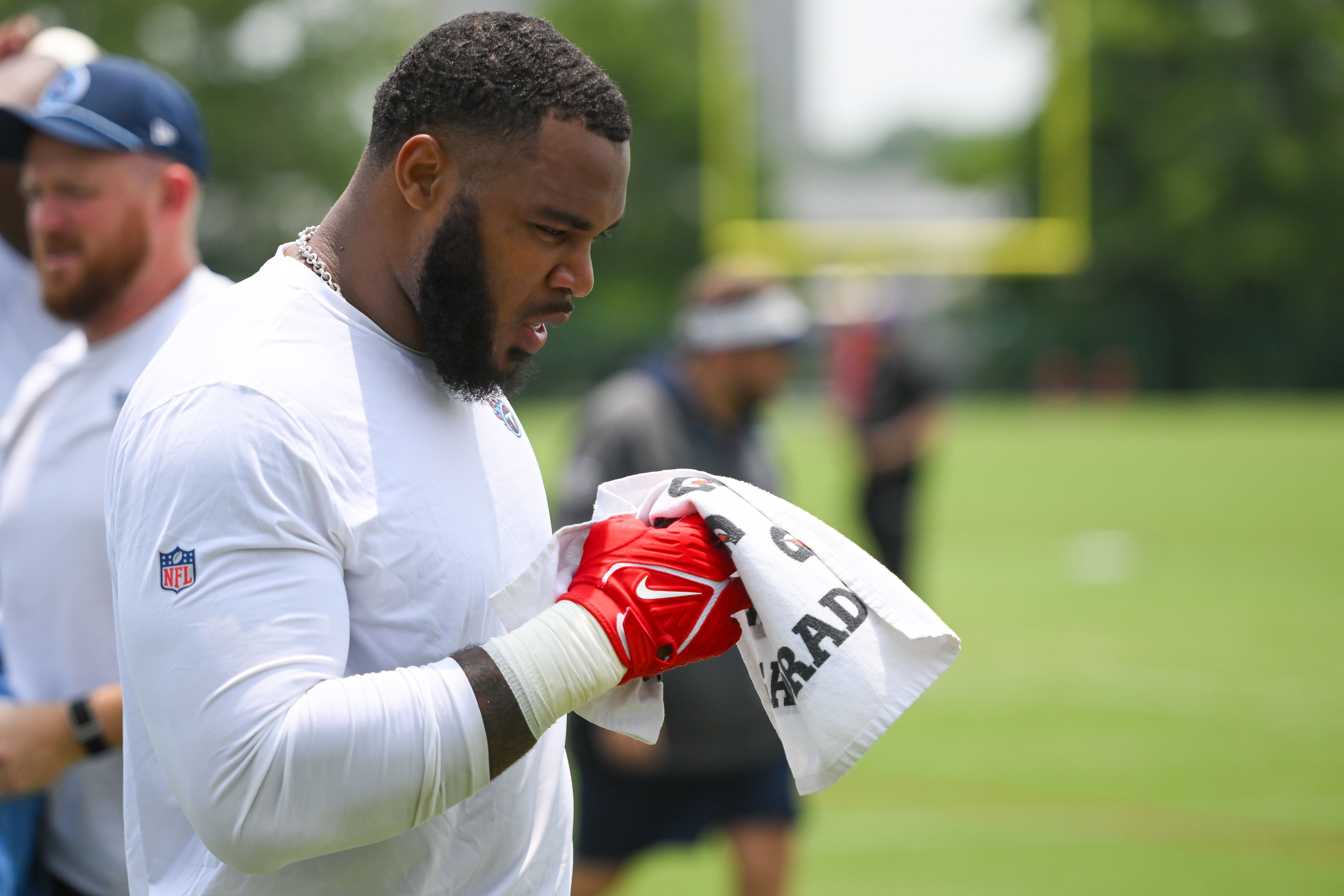Jun 10, 2025; Nashville, TN, USA; Tennessee Titans defensive tackle Jeffery Simmons (98) walks to meet reporters during minicamp at Nissan Stadium. Mandatory Credit: Steve Roberts-Imagn Images