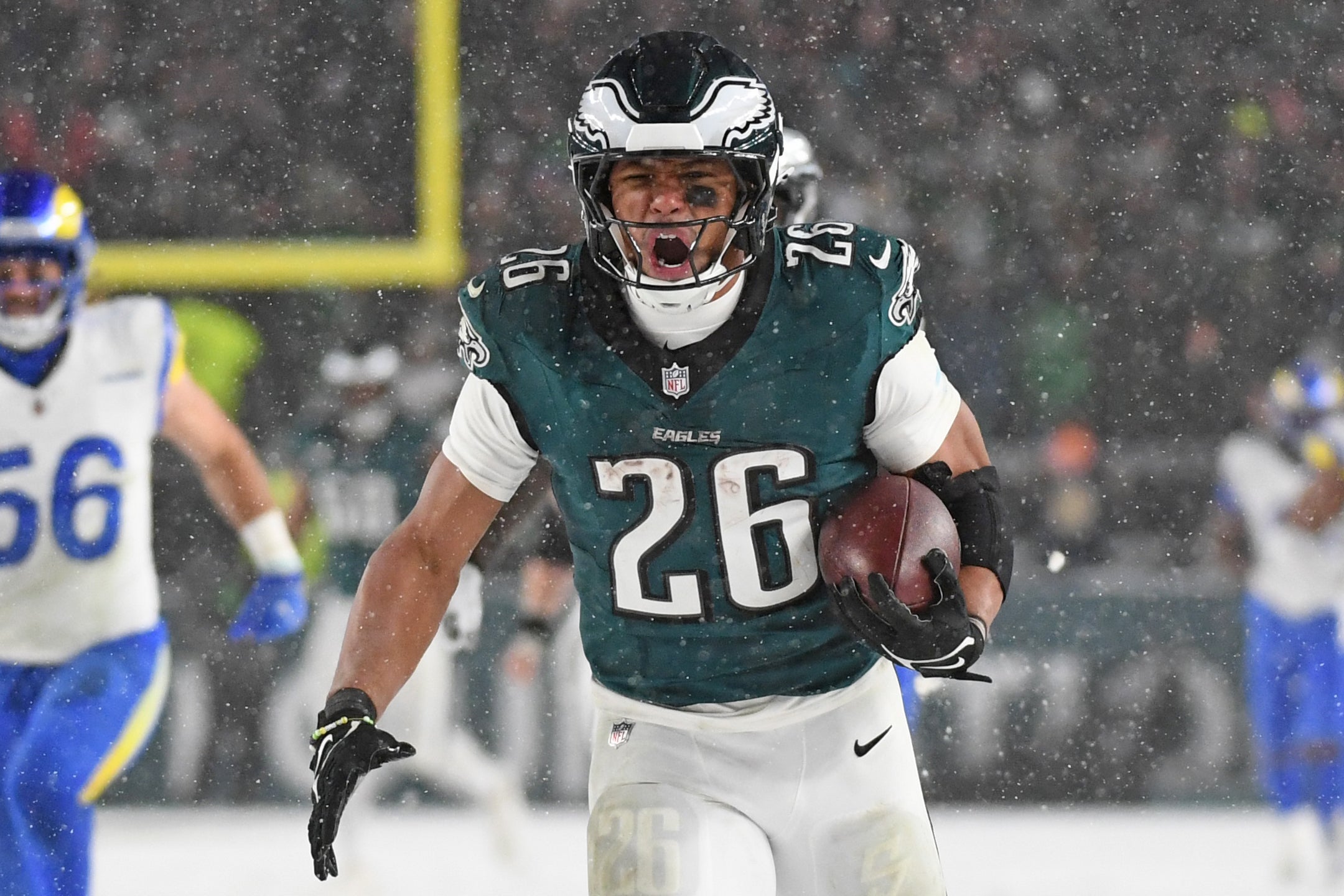 Philadelphia Eagles running back Saquon Barkley (26) runs for on a 78-yard touchdown run against the Los Angeles Rams during the fourth quarter in a 2025 NFC divisional round game at Lincoln Financial