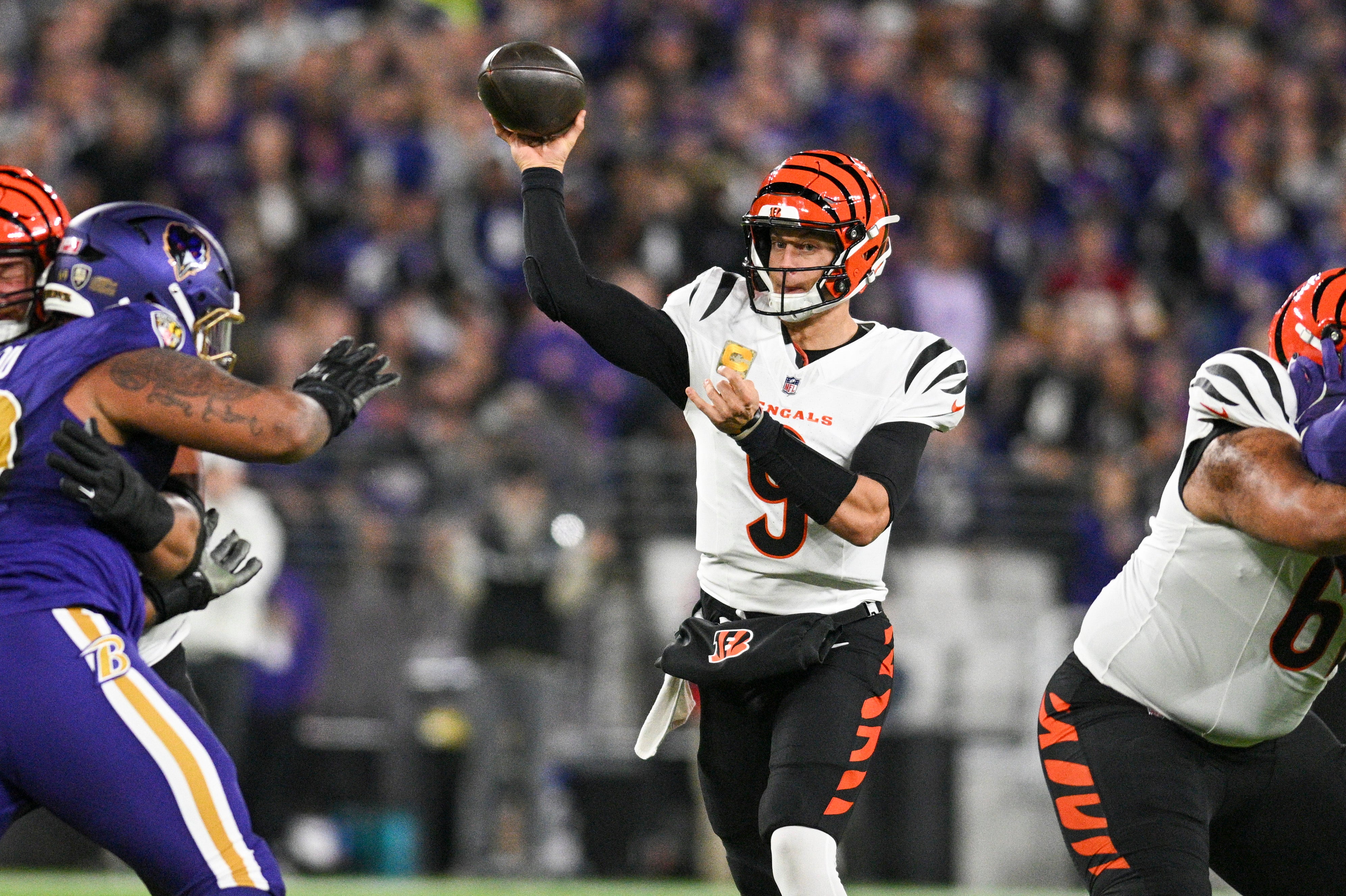 Nov 7, 2024; Baltimore, Maryland, USA; Cincinnati Bengals quarterback Joe Burrow (9) throws from the pocket during the first quarter against the Baltimore Ravens at M&T Bank Stadium.