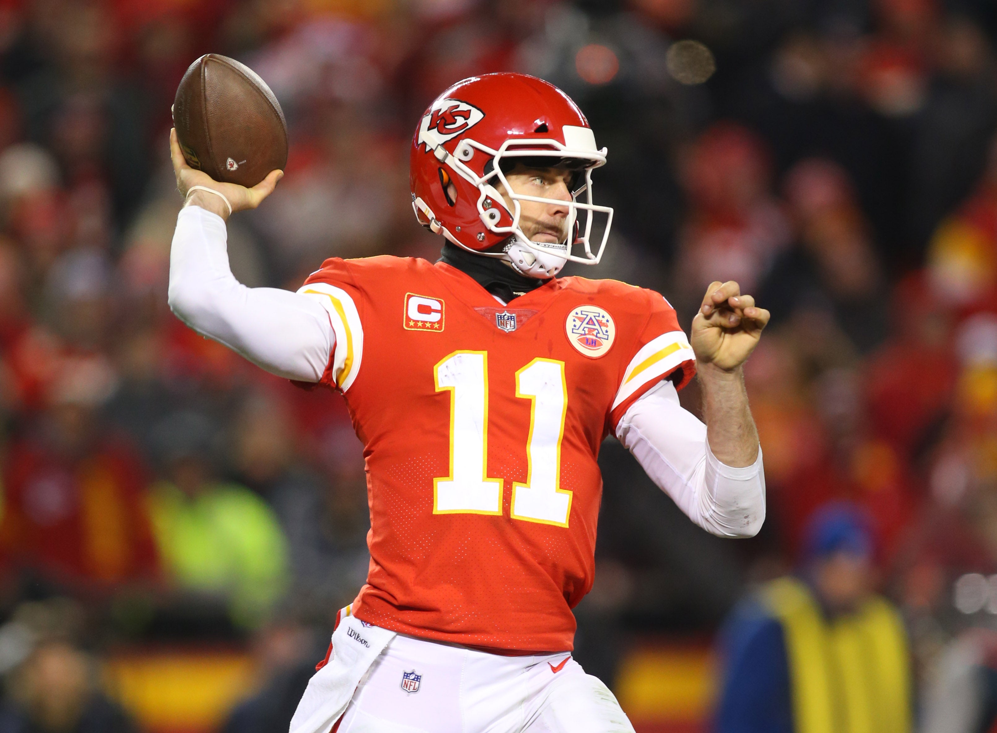 Kansas City Chiefs quarterback Alex Smith throws a pass against the Tennessee Titans during the fourth quarter in the AFC Wild Card playoff football game at Arrowhead Stadium.