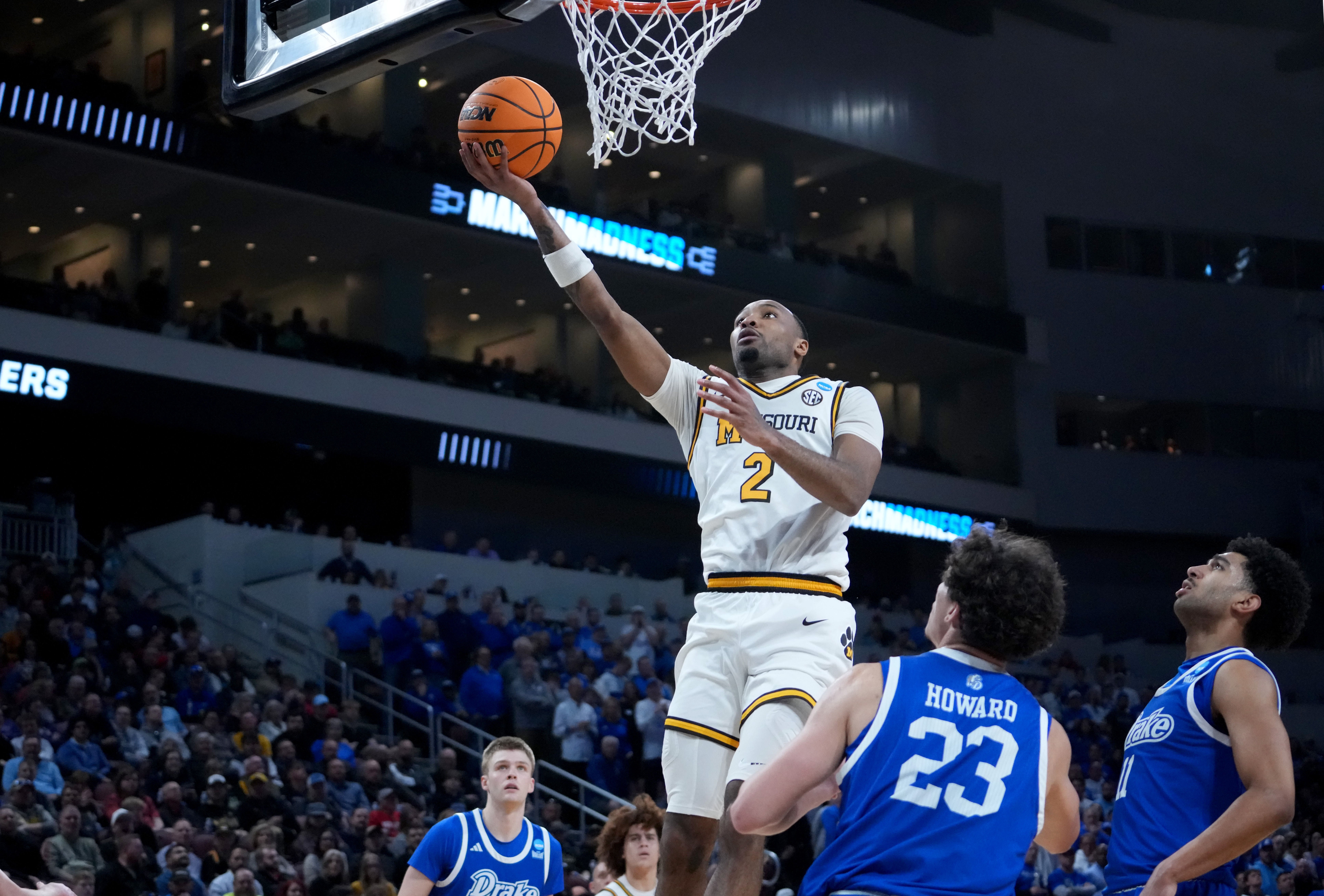 Mar 20, 2025; Wichita, KS, USA; Missouri Tigers guard Tamar Bates (2) shoots against Drake Bulldogs guard Isaia Howard (23) in the second half of a first round men’s NCAA Tournament game at Intrust Bank Arena.