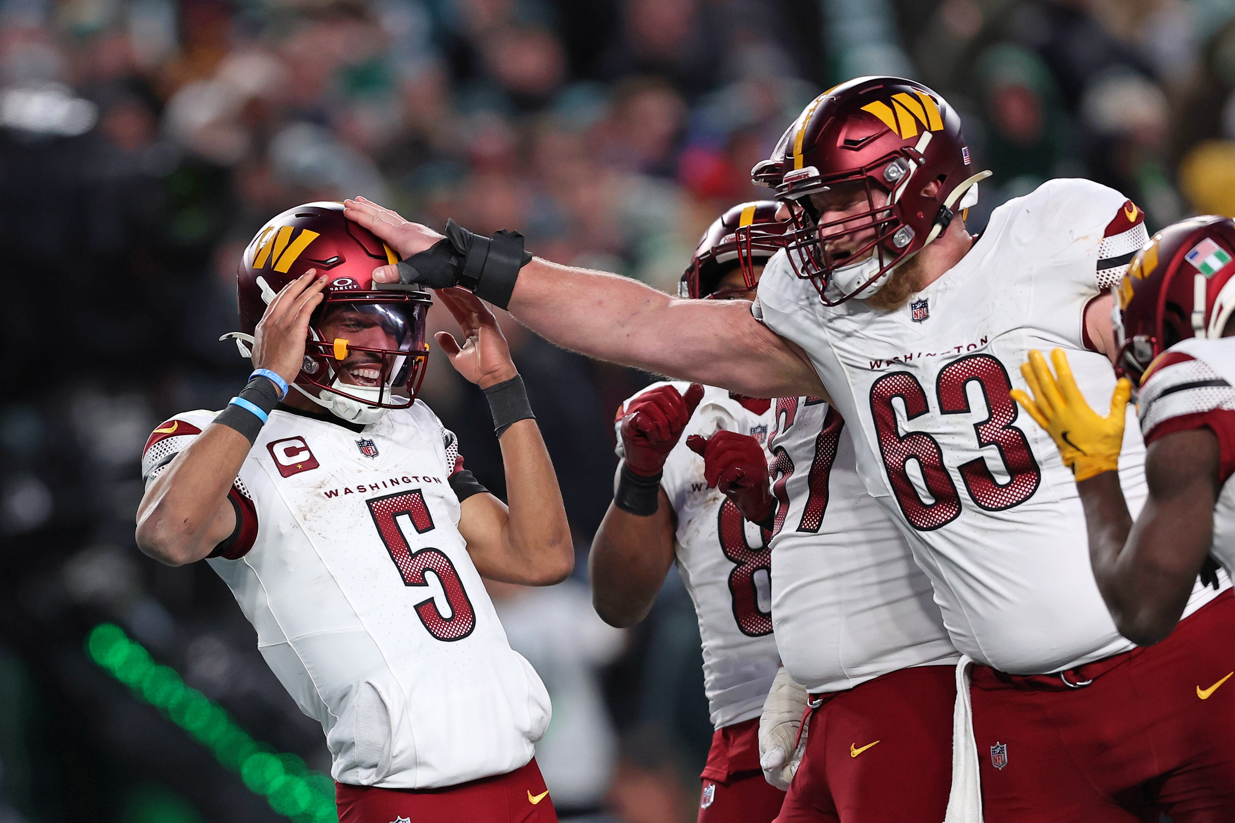 Washington Commanders quarterback Jayden Daniels (5) celebrates after a play against the Philadelphia Eagles during the second half in the NFC Championship game at Lincoln Financial Field.