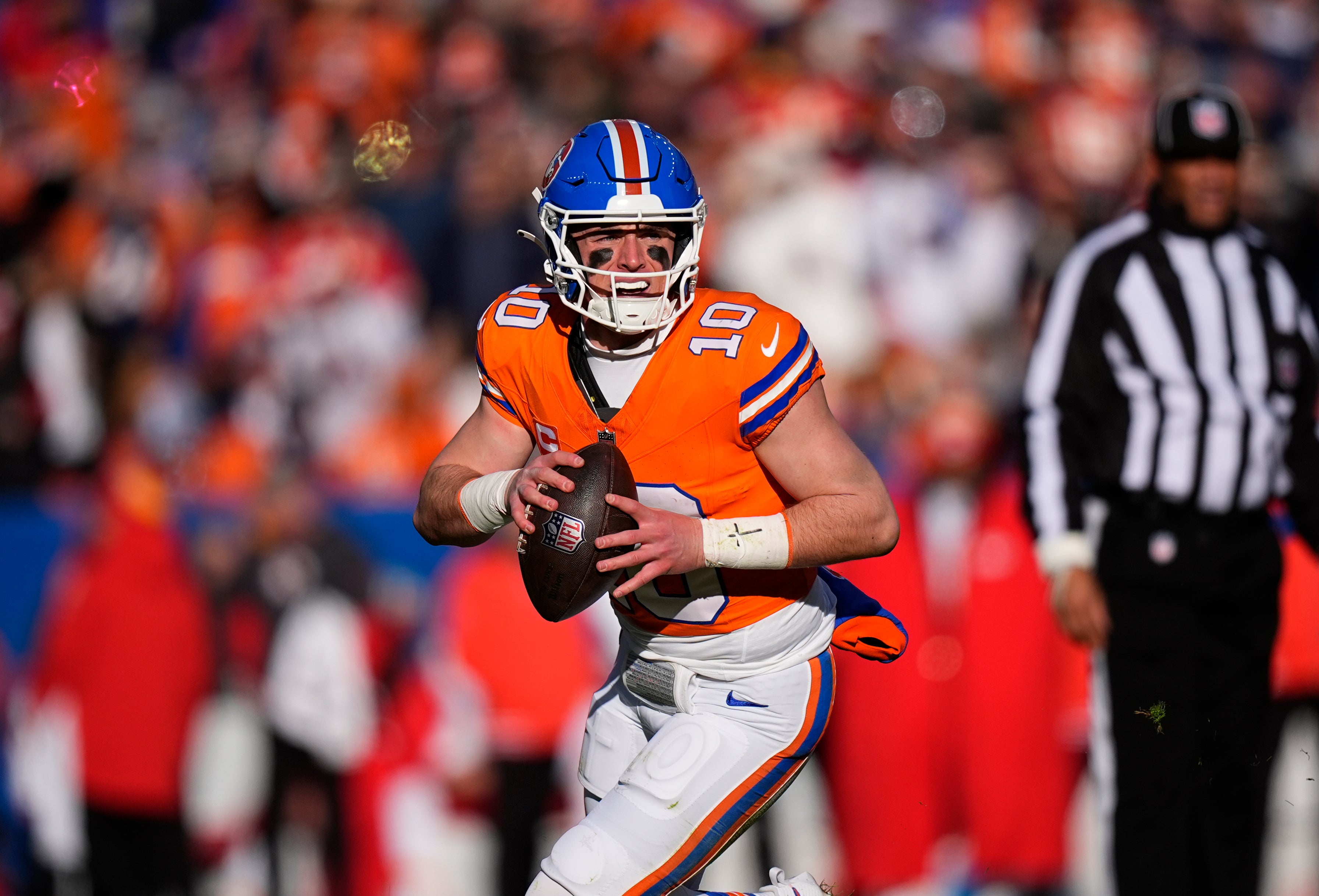 Jan 5, 2025; Denver, Colorado, USA; Denver Broncos quarterback Bo Nix (10) prepares to pass the ball in the first quarter against the Kansas City Chiefs at Empower Field at Mile High.