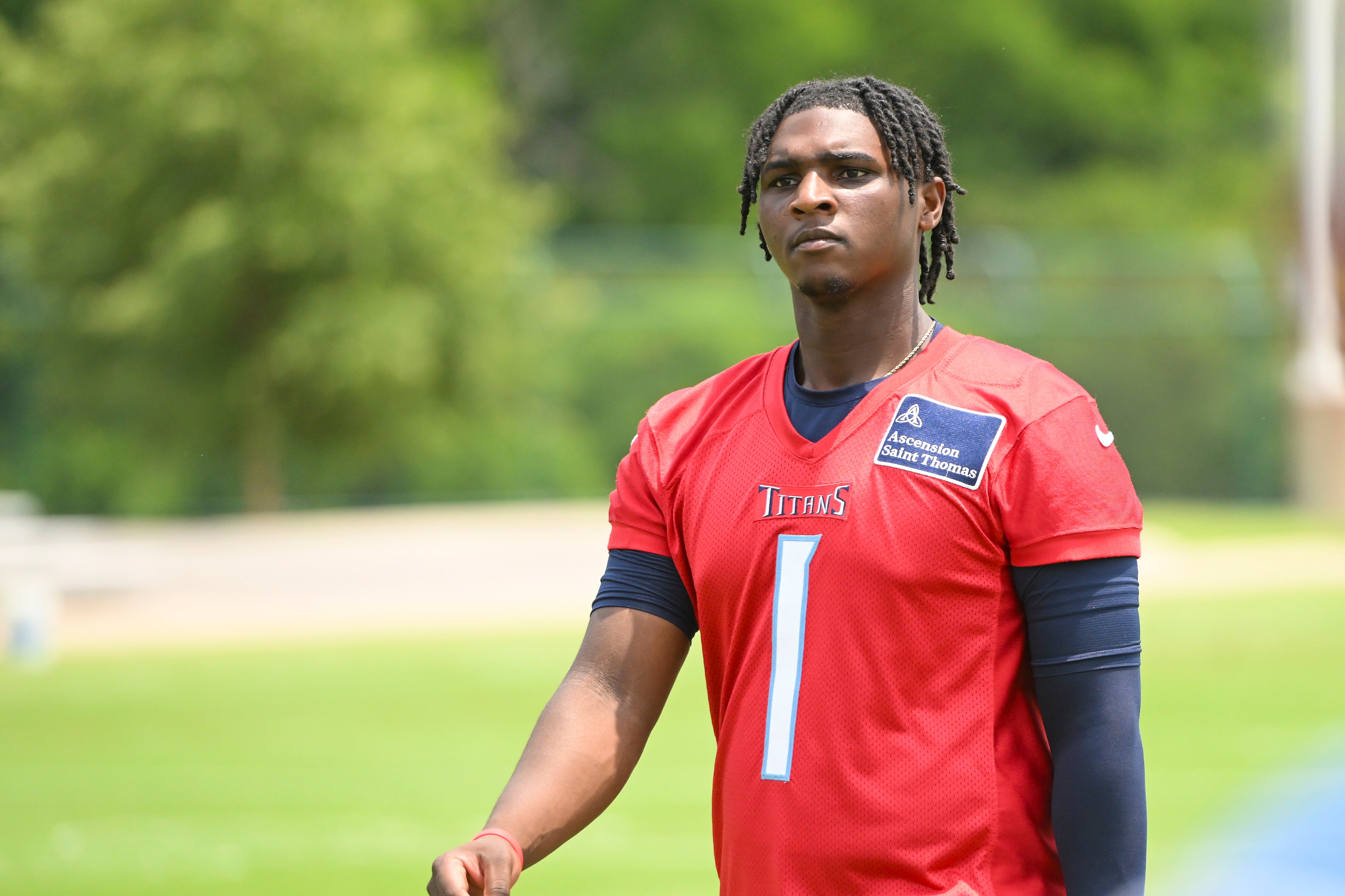 Jun 10, 2025; Nashville, TN, USA; Tennessee Titans quarterback Cam Ward (1) walks off the field during minicamp at Nissan Stadium. Mandatory Credit: Steve Roberts-Imagn Images