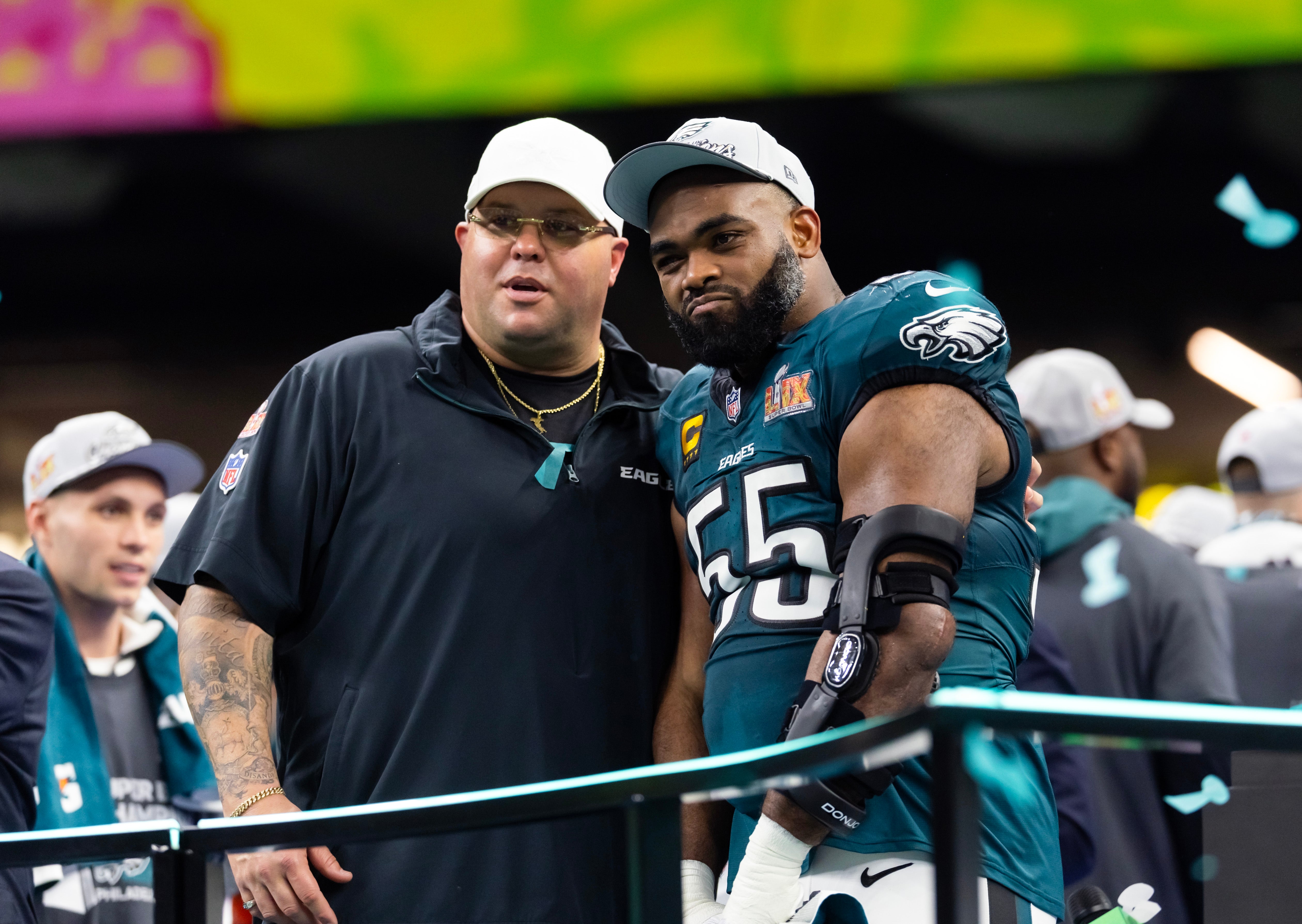 Philadelphia Eagles defensive end Brandon Graham (55) with team security guard Dom DiSandro after defeating the Kansas City Chiefs during Super Bowl LIX at Ceasars Superdome.