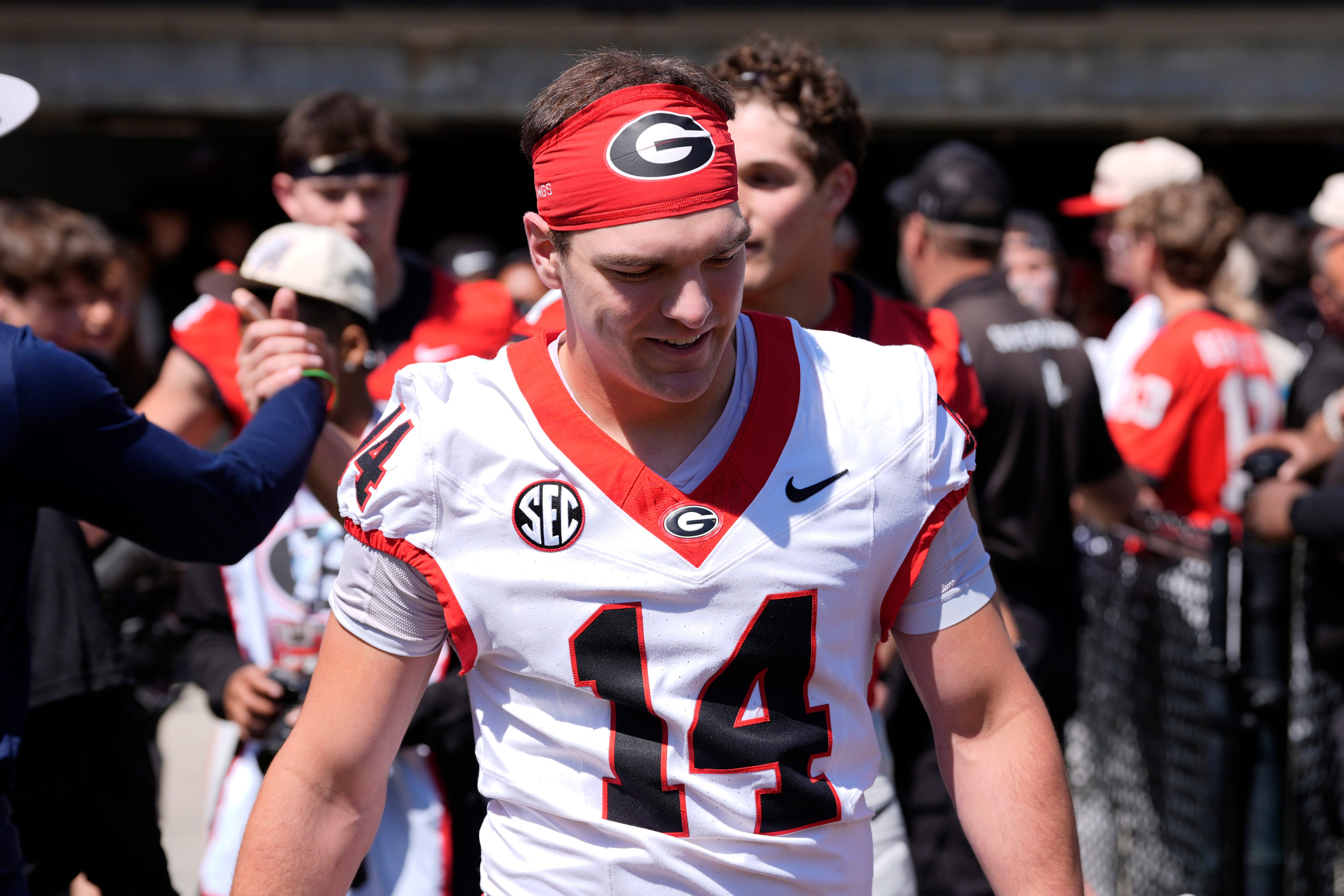 Georgia quarterback Gunner Stockton (14) arrives before the start of the Georgia G-Day spring football game in Athens, Ga., on Saturday, April 12, 2025.