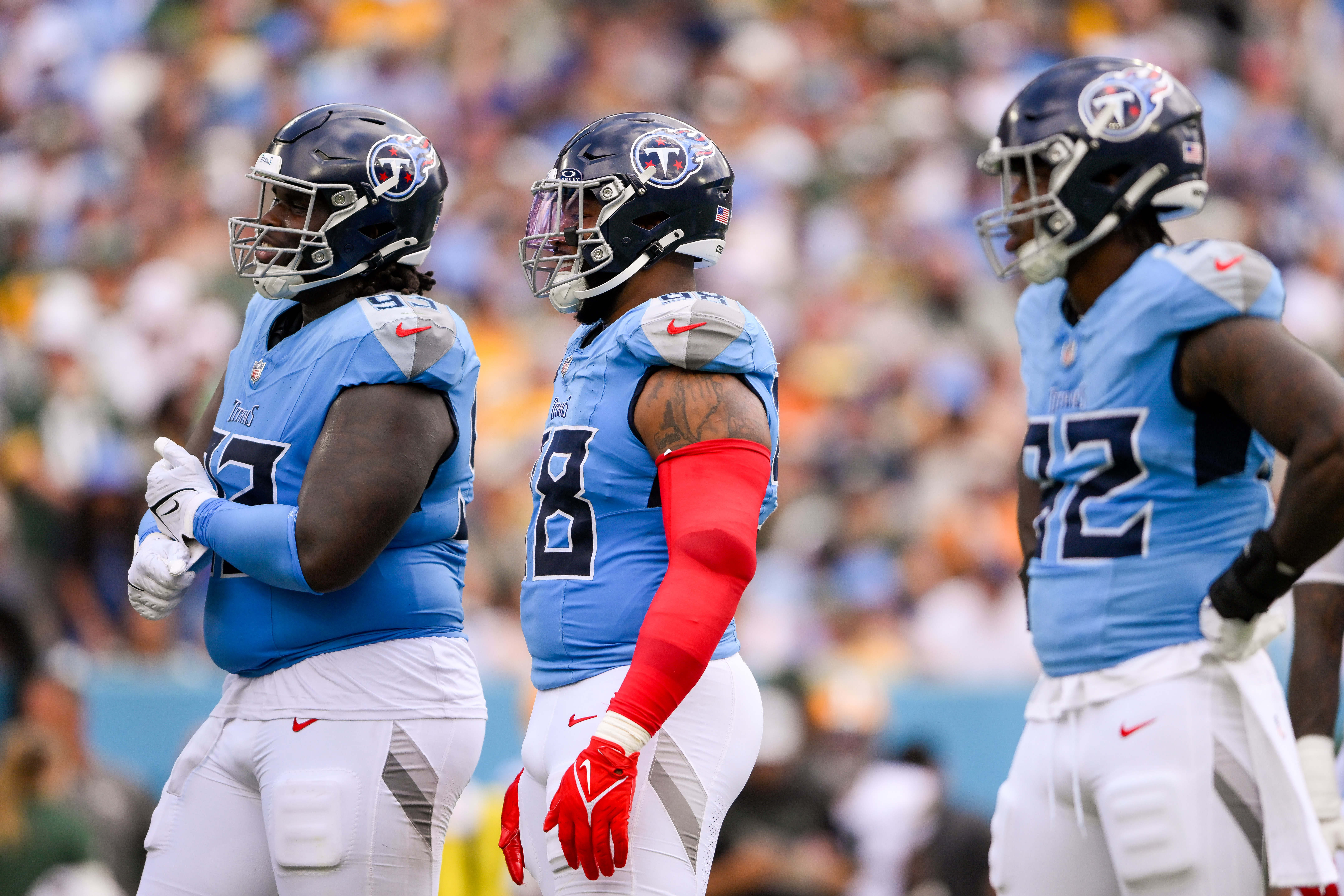 Sep 22, 2024; Nashville, Tennessee, USA; Tennessee Titans defensive tackle T'Vondre Sweat (93), defensive tackle Jeffery Simmons (98), linebacker Jaylen Harrell (92) waits for the offense to come to the line against the Green Bay Packers during the first half at Nissan Stadium. Mandatory Credit: Steve Roberts-Imagn Images