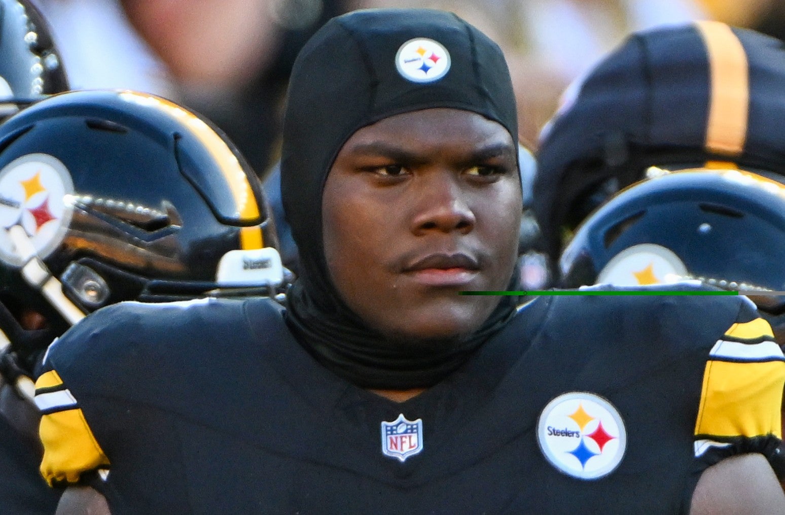 Aug 9, 2024; Pittsburgh, Pennsylvania, USA; Pittsburgh Steelers offensive tackle Broderick Jones (77) watches warm ups against the Houston Texans at Acrisure Stadium.