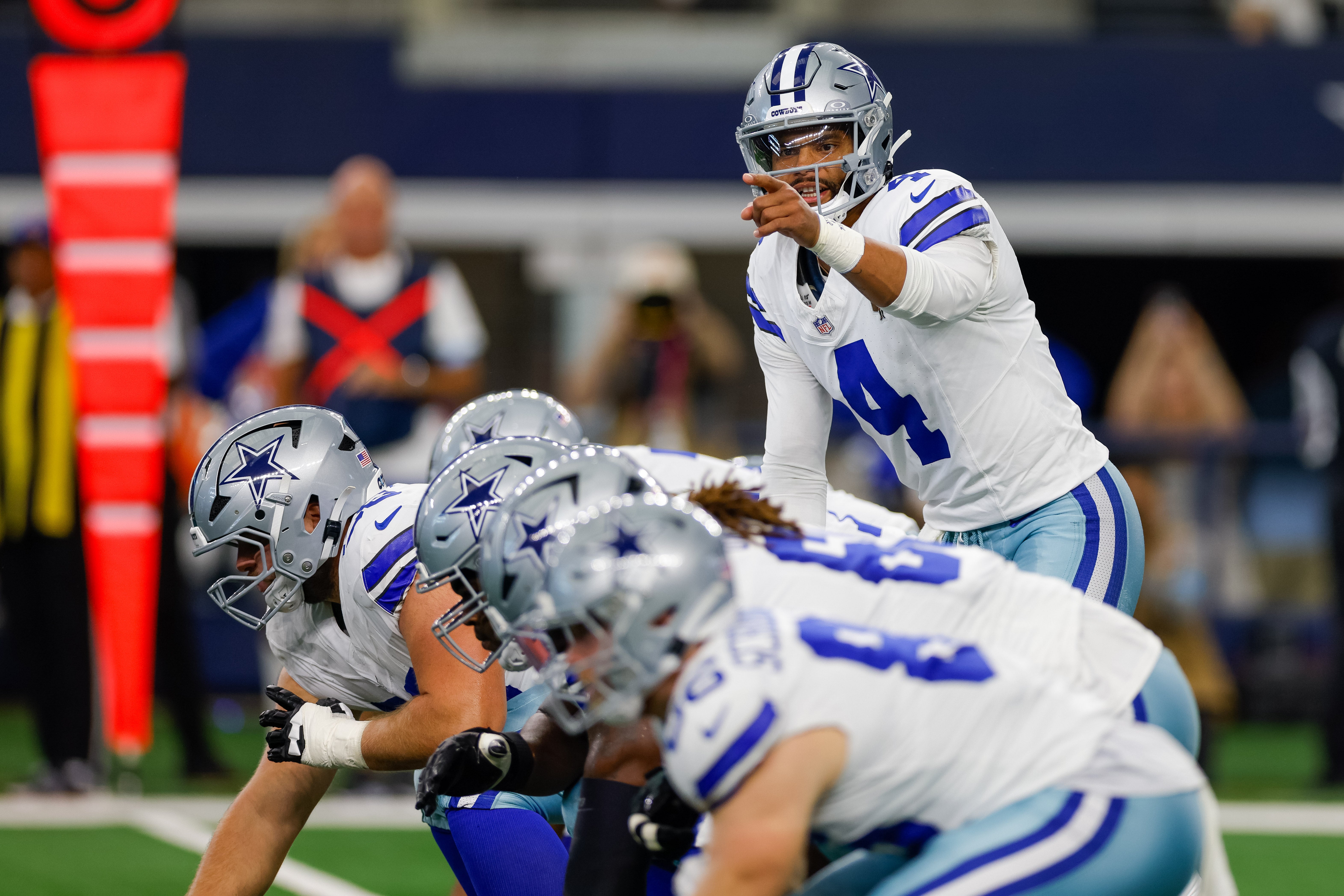 Dallas Cowboys quarterback Dak Prescott (4) sets up at the line of scrimmage during the first quarter against the Baltimore Ravens at AT&T Stadium.