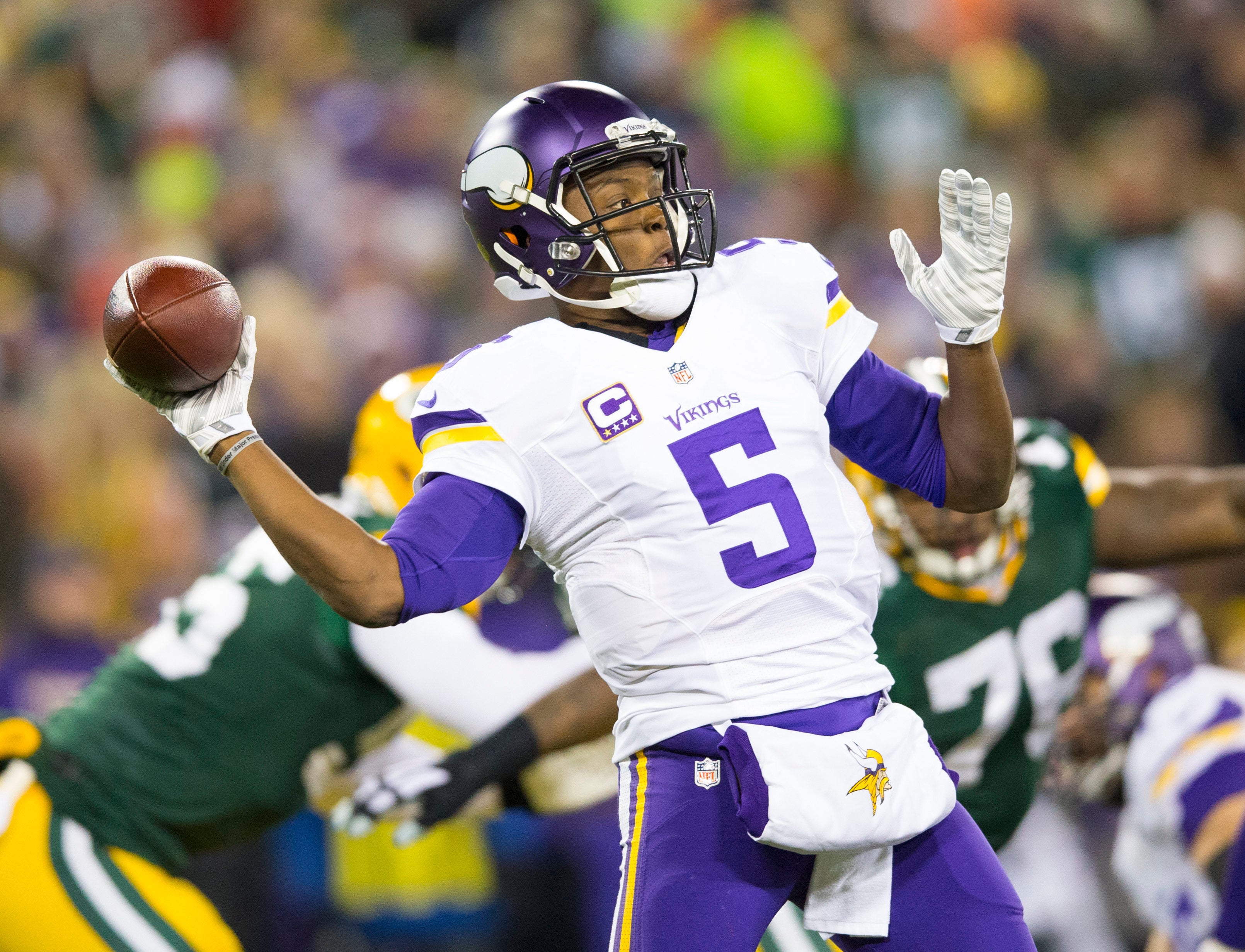 Jan 3, 2016; Green Bay, WI, USA; Minnesota Vikings quarterback Teddy Bridgewater (5) throws a pass during the first quarter against the Green Bay Packers at Lambeau Field.