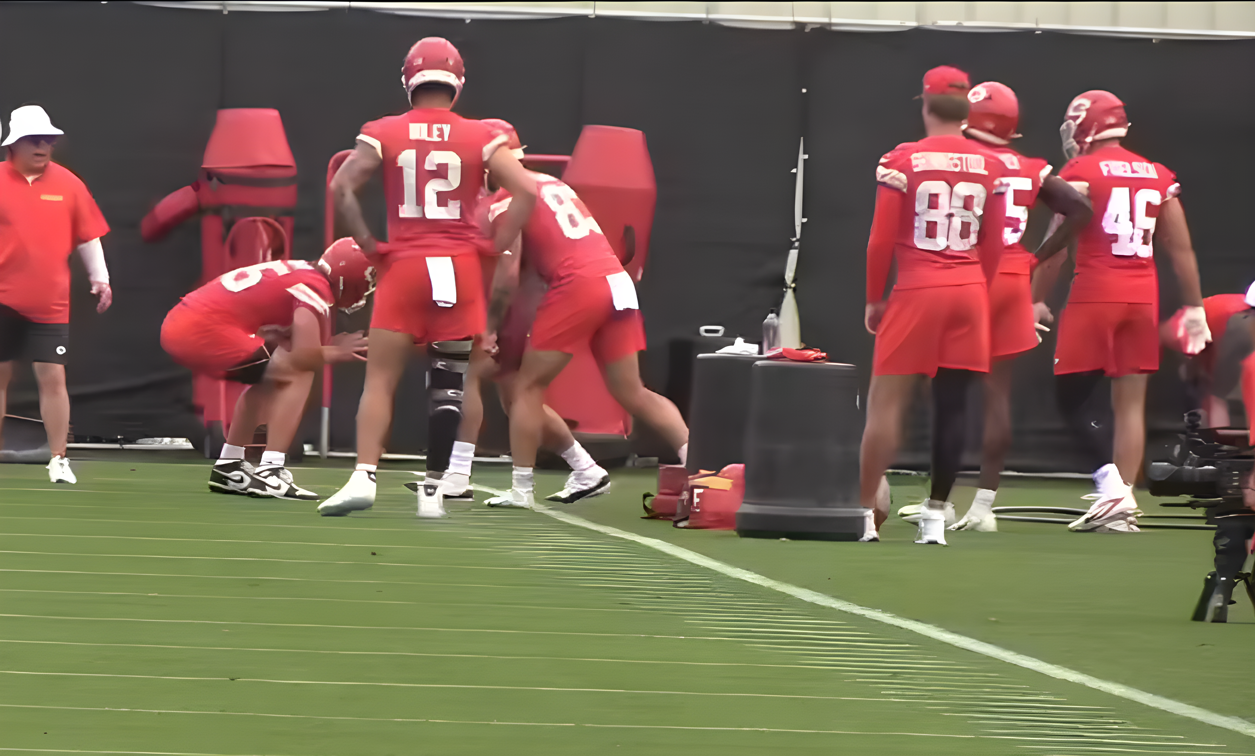Chiefs TE Jared Wiley watches as teammates participate in drills during mandatory minicamp practices.