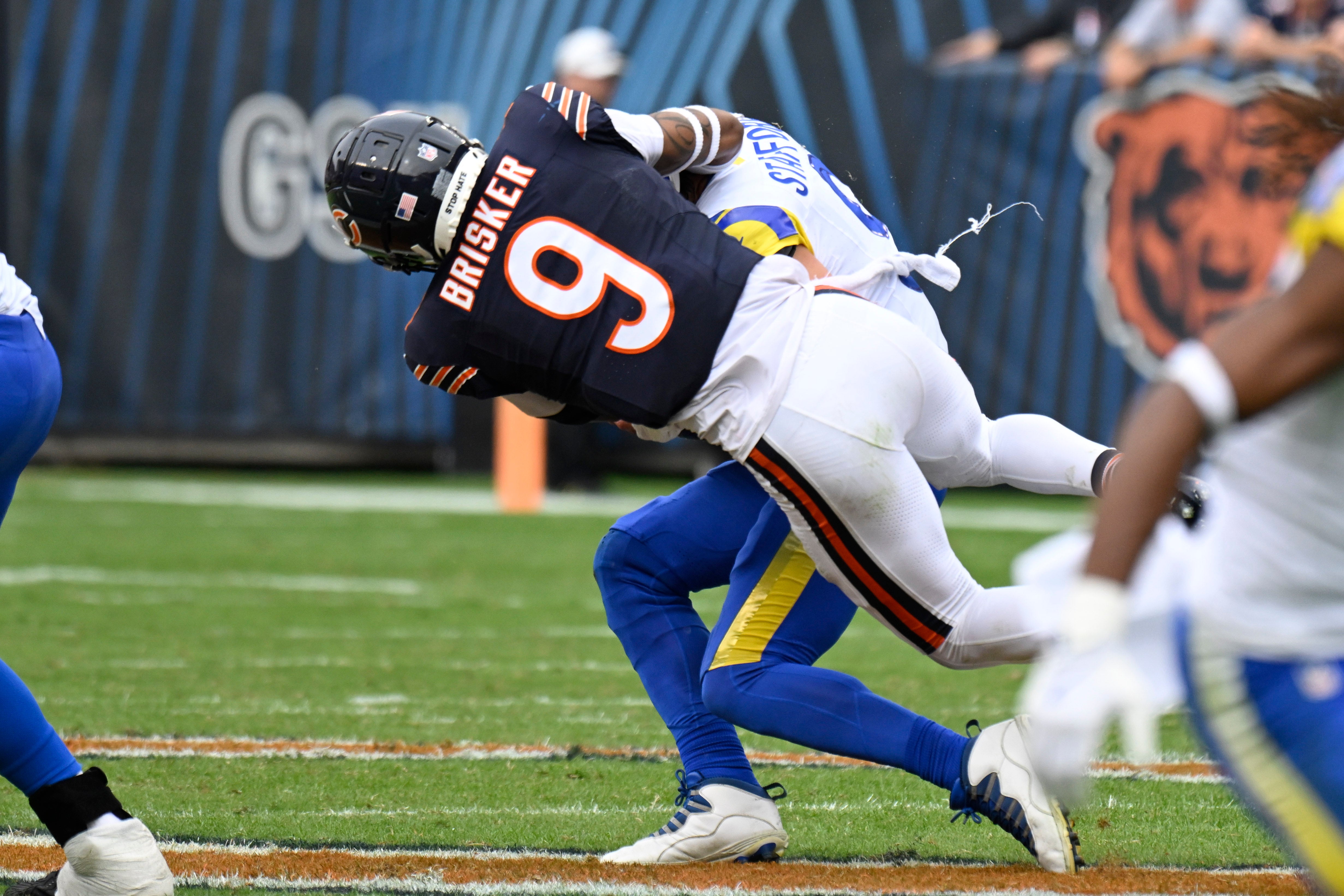 Sep 29, 2024; Chicago, Illinois, USA; Chicago Bears safety Jaquan Brisker (9) sacks Los Angeles Rams quarterback Matthew Stafford (9) during the second half at Soldier Field.
