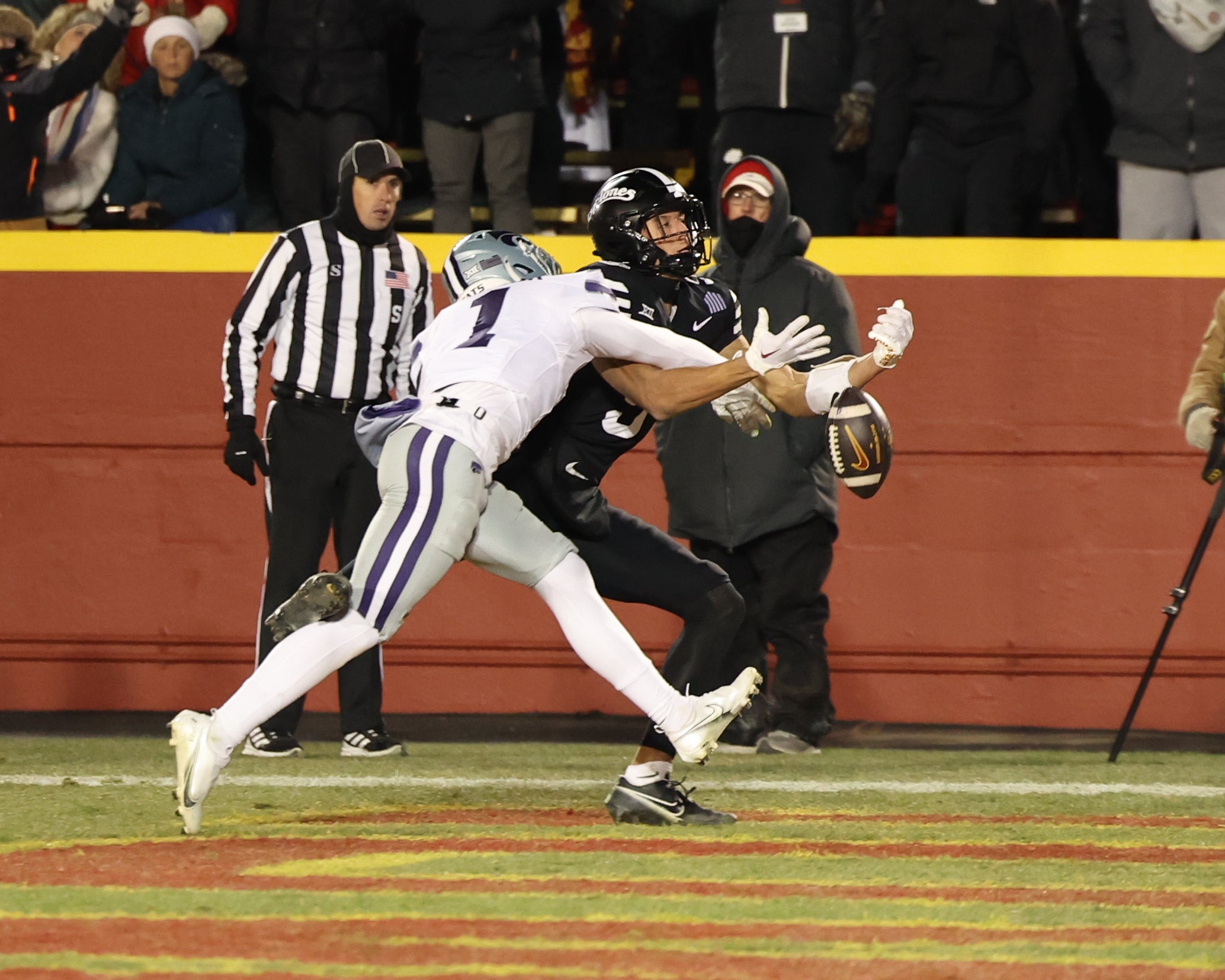 Nov 30, 2024; Ames, Iowa, USA; Kansas State Wildcats cornerback Keenan Garber (1) breaks up a pass intended for Iowa State Cyclones wide receiver Jayden Higgins (9) in the first quarter at at Jack Trice Stadium.