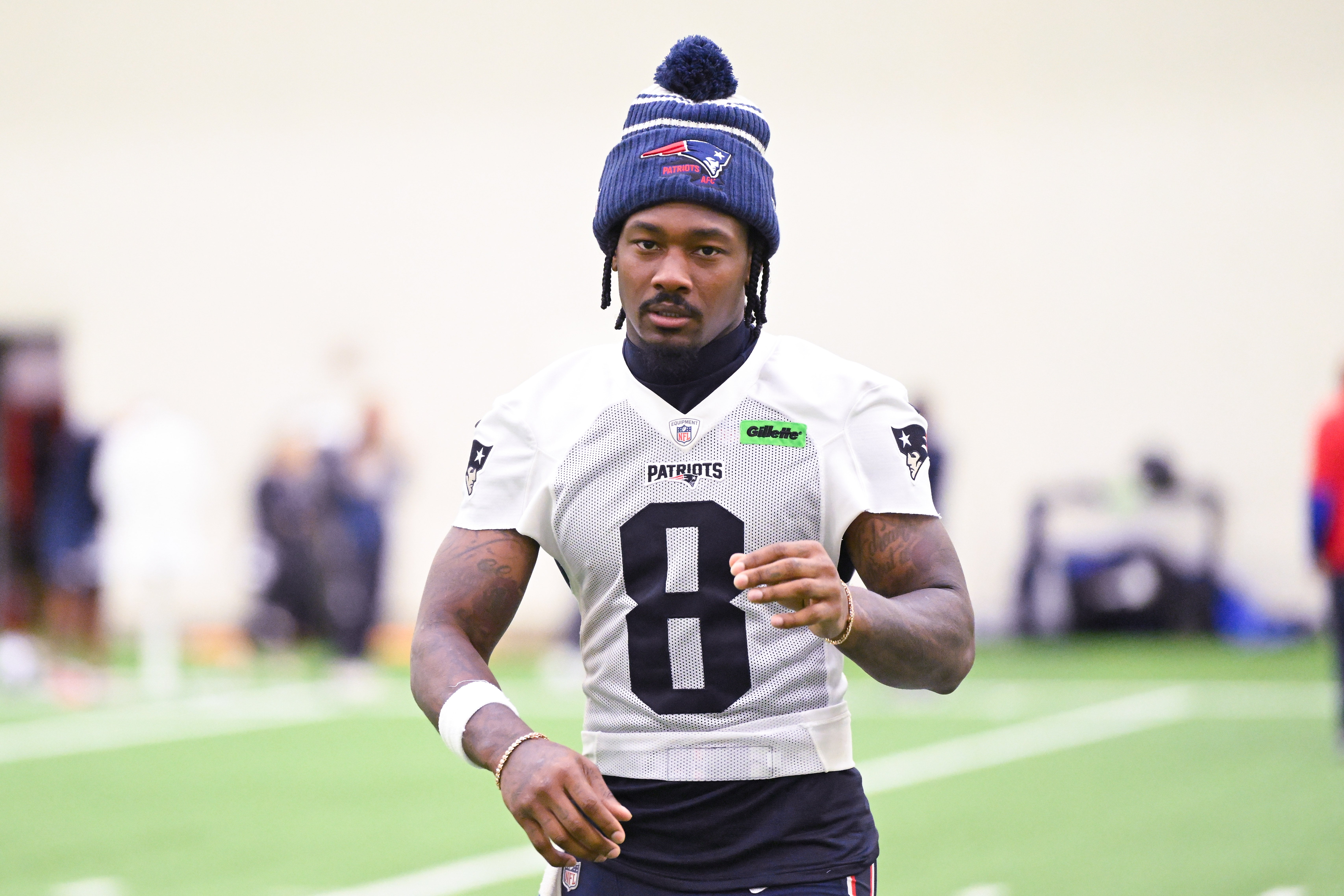 New England Patriots wide receiver Stefon Diggs (8) walks to the podium to speak to the media after minicamp held in the WIN Field House at Gillette Stadium.