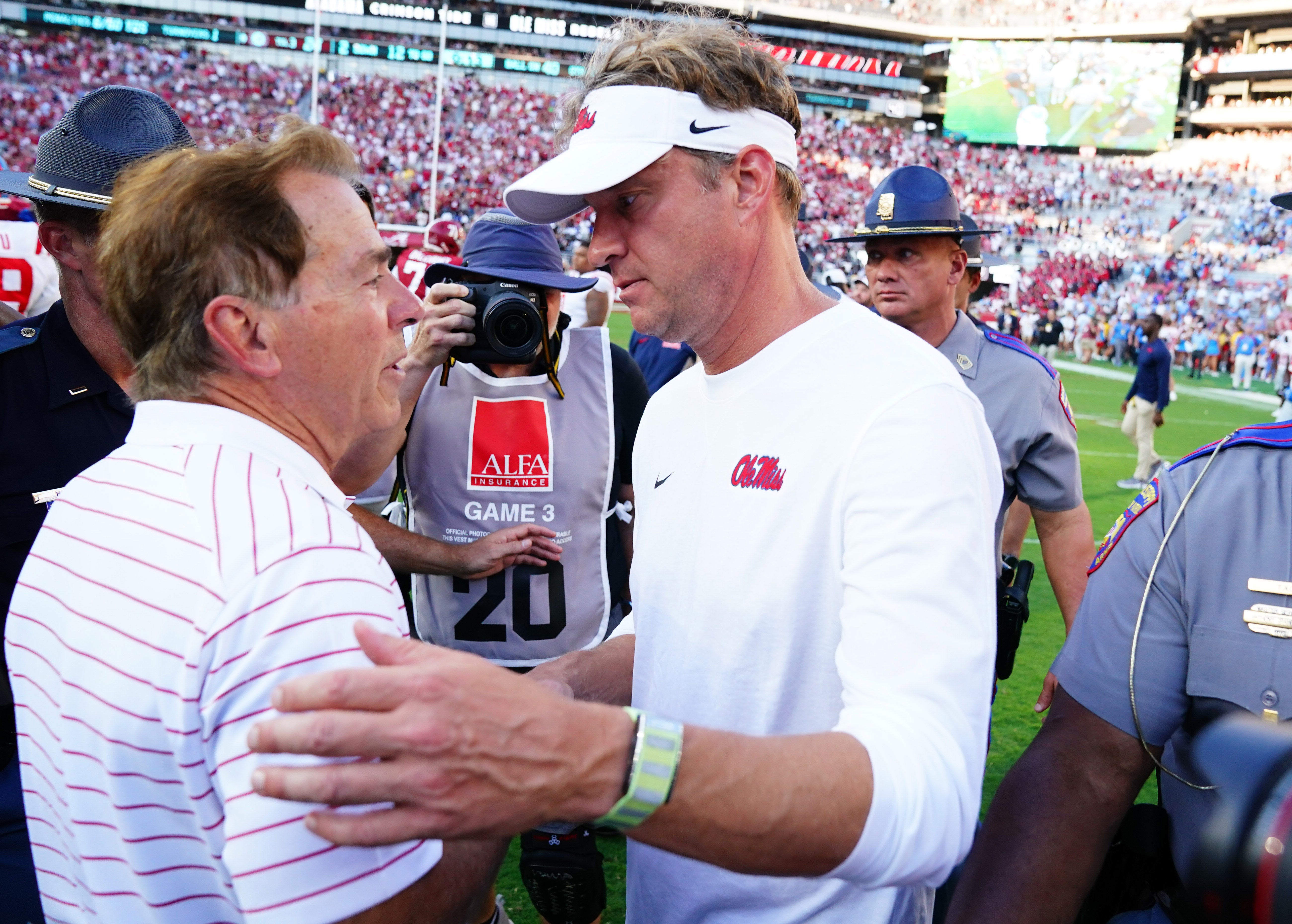 Sep 23, 2023; Tuscaloosa, Alabama, USA; Alabama Crimson Tide head coach Nick Saban greets Mississippi Rebels head coach Lane Kiffin midfield after Alabama defeated the Rebels 24-10 at Bryant-Denny Stadium. Mandatory Credit: John David Mercer-Imagn Images