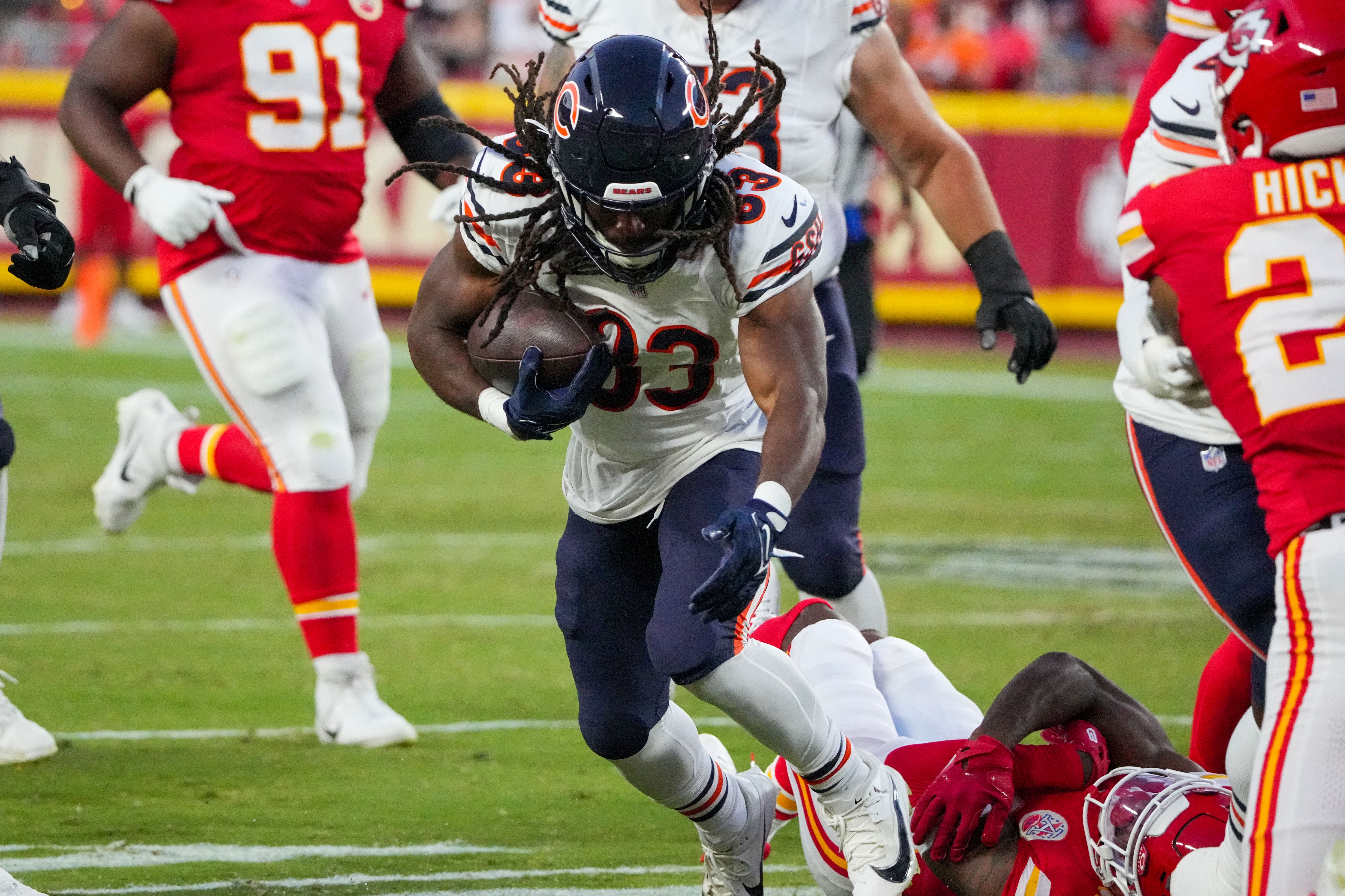 Aug 22, 2024; Kansas City, Missouri, USA; Chicago Bears running back Ian Wheeler (33) runs the ball against the Kansas City Chiefs during the game at GEHA Field at Arrowhead Stadium.