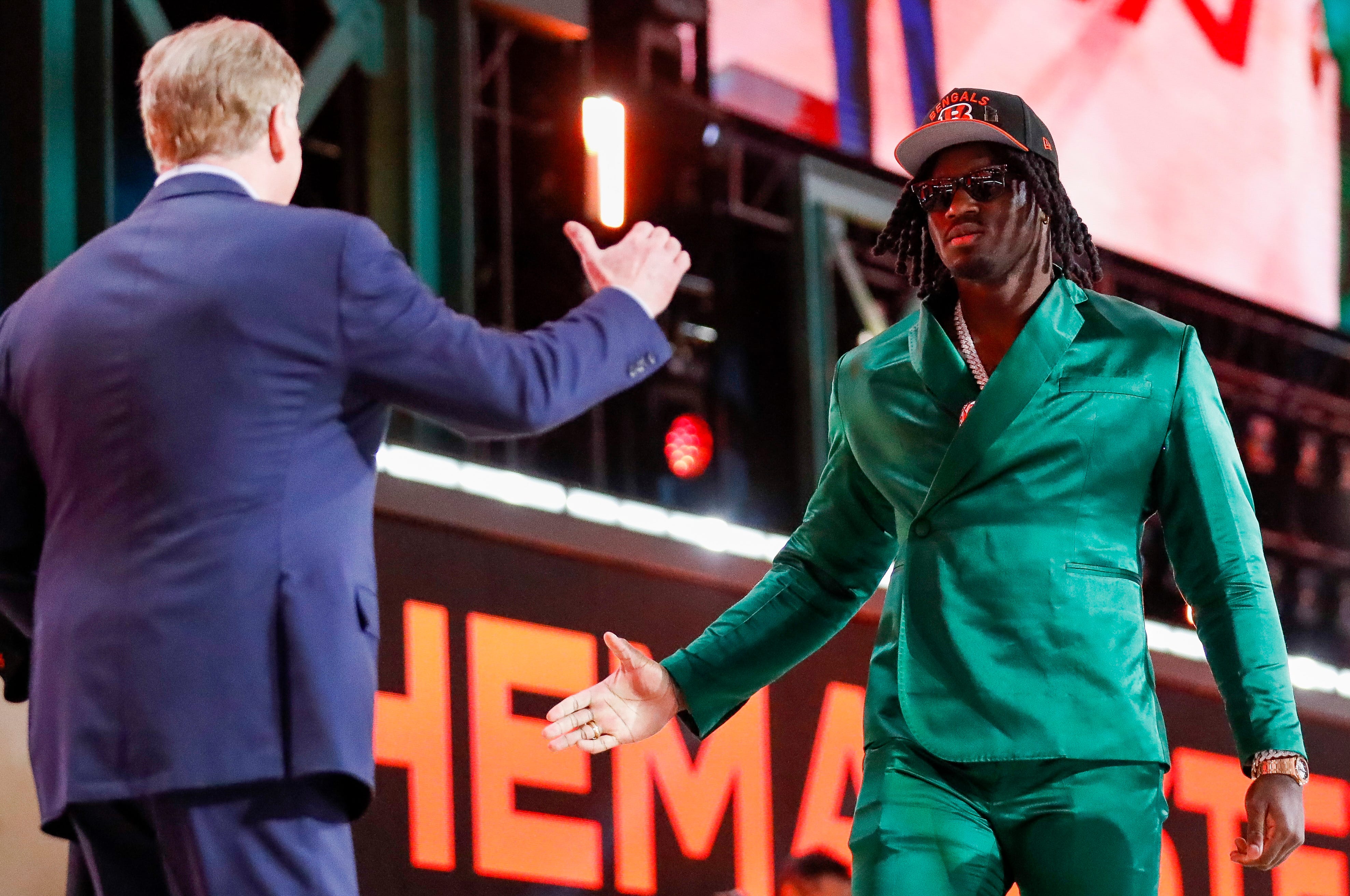 Edge rusher Shemar Stewart is greeted by NFL Commissioner Roger Goodell after being selected 17th overall by the Cincinnati Bengals during the first round of the 2025 NFL Draft on Thursday, April 24, 2025, at Lambeau Field in Green Bay, Wisconsin.