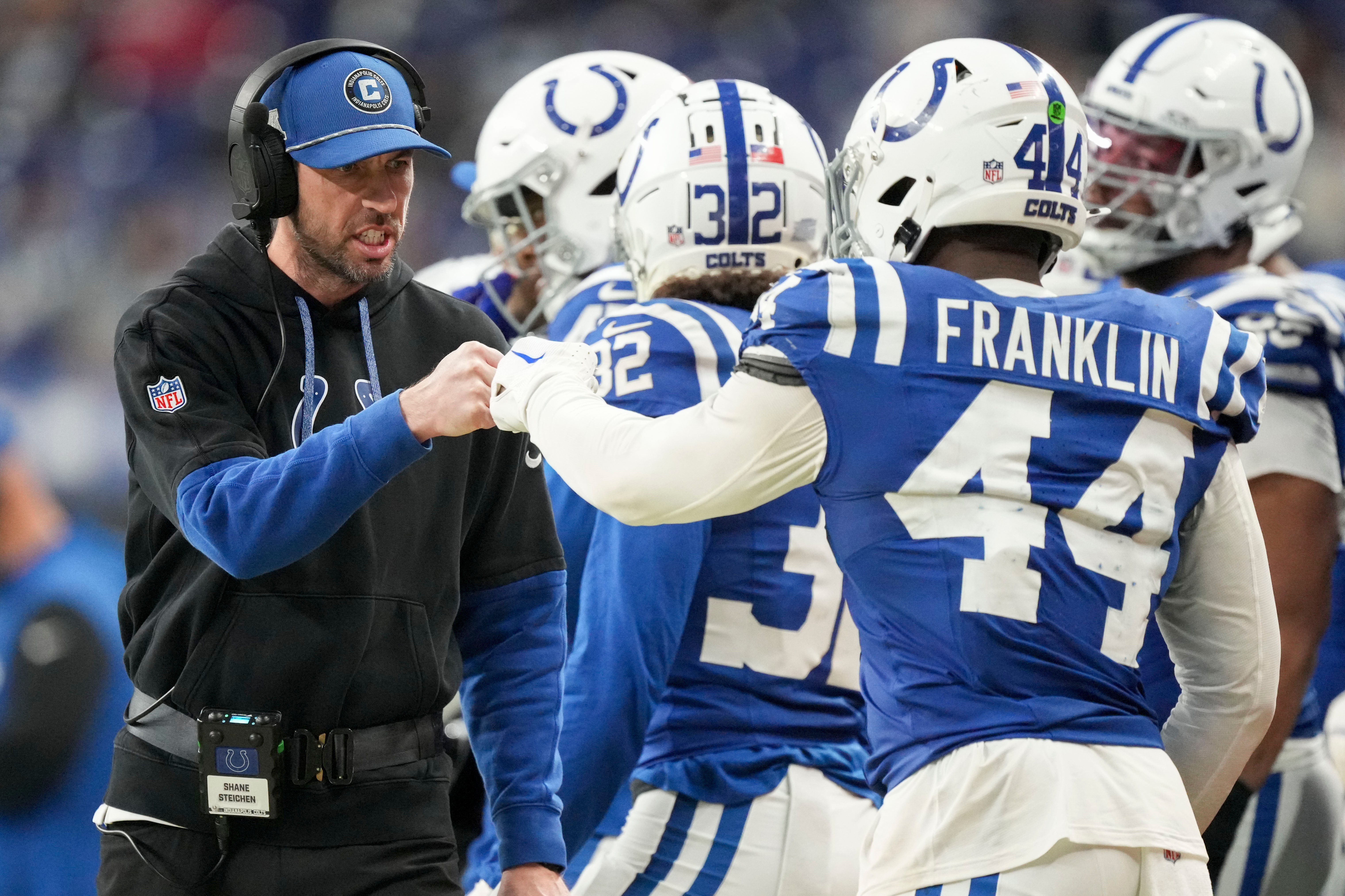 Jan 5, 2025; Indianapolis, Indiana, USA; Indianapolis Colts Head Coach Shane Steichen fist bumps Indianapolis Colts linebacker Zaire Franklin (44) during a game against the Jacksonville Jaguars at Lucas Oil Stadium.